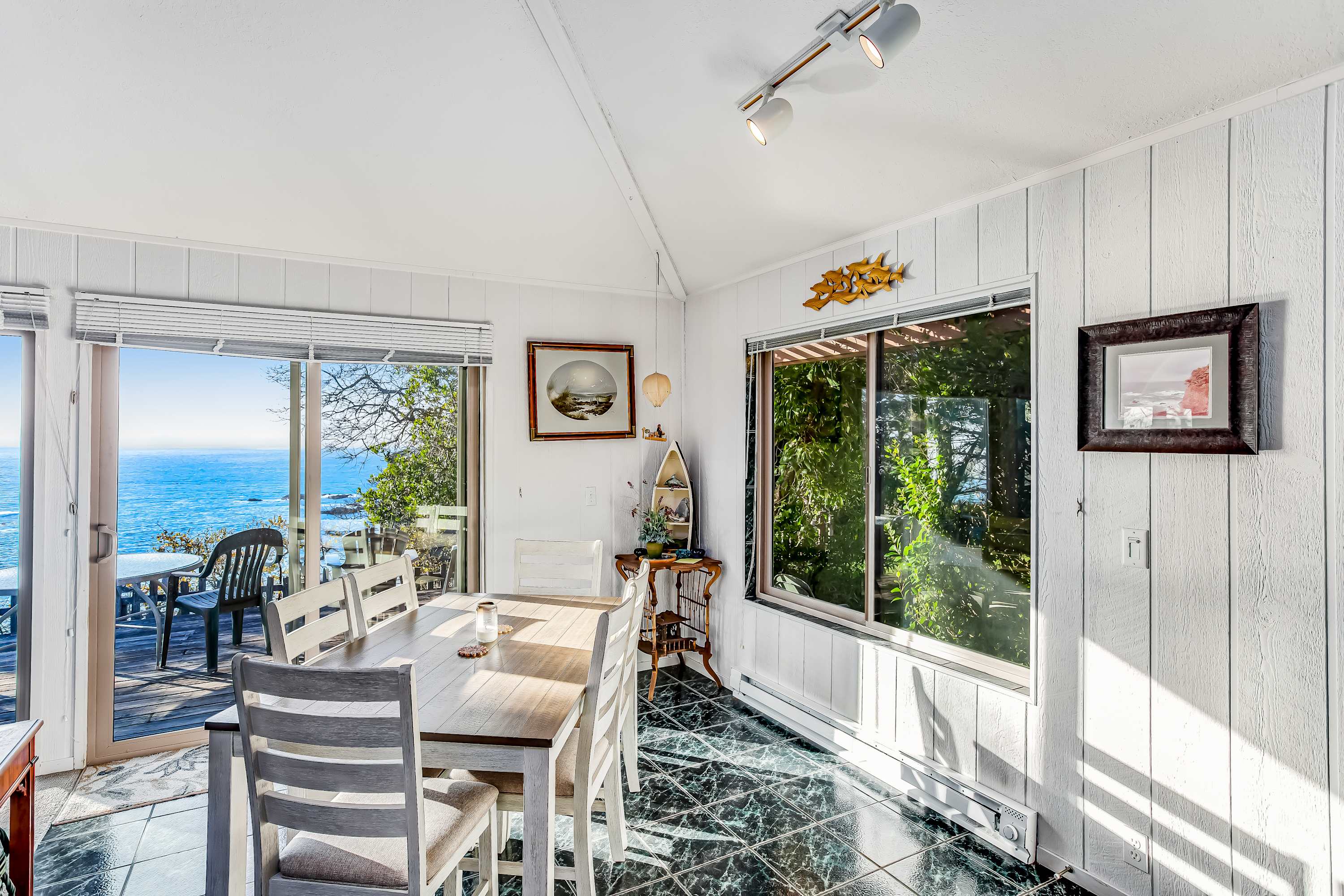 Share meals with a view at the dining table, where the beauty of the coastline enhances every dining experience.