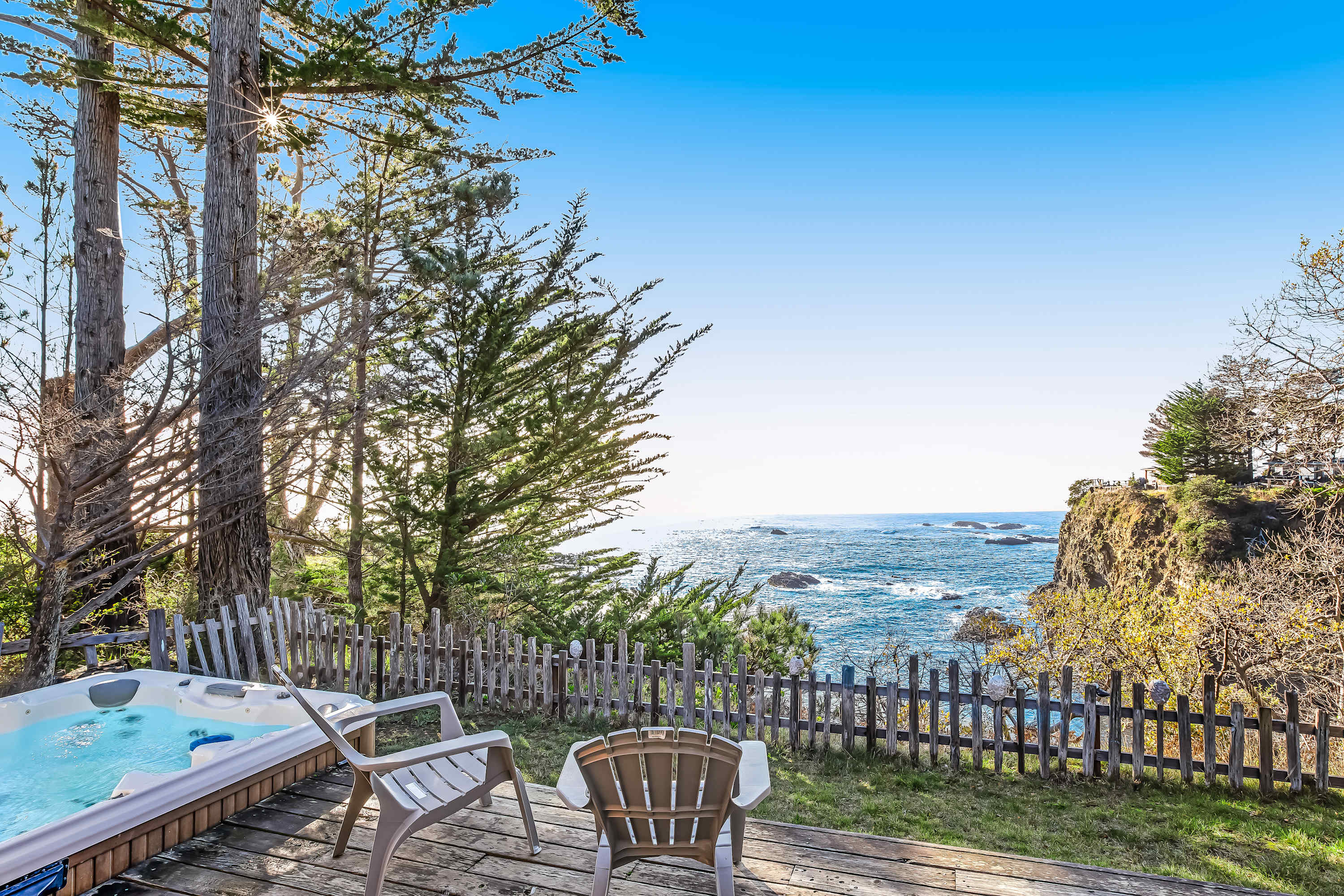 Nestled among the trees, your private hot tub offers a tranquil escape, where you can unwind while gazing at the stunning ocean scenery.