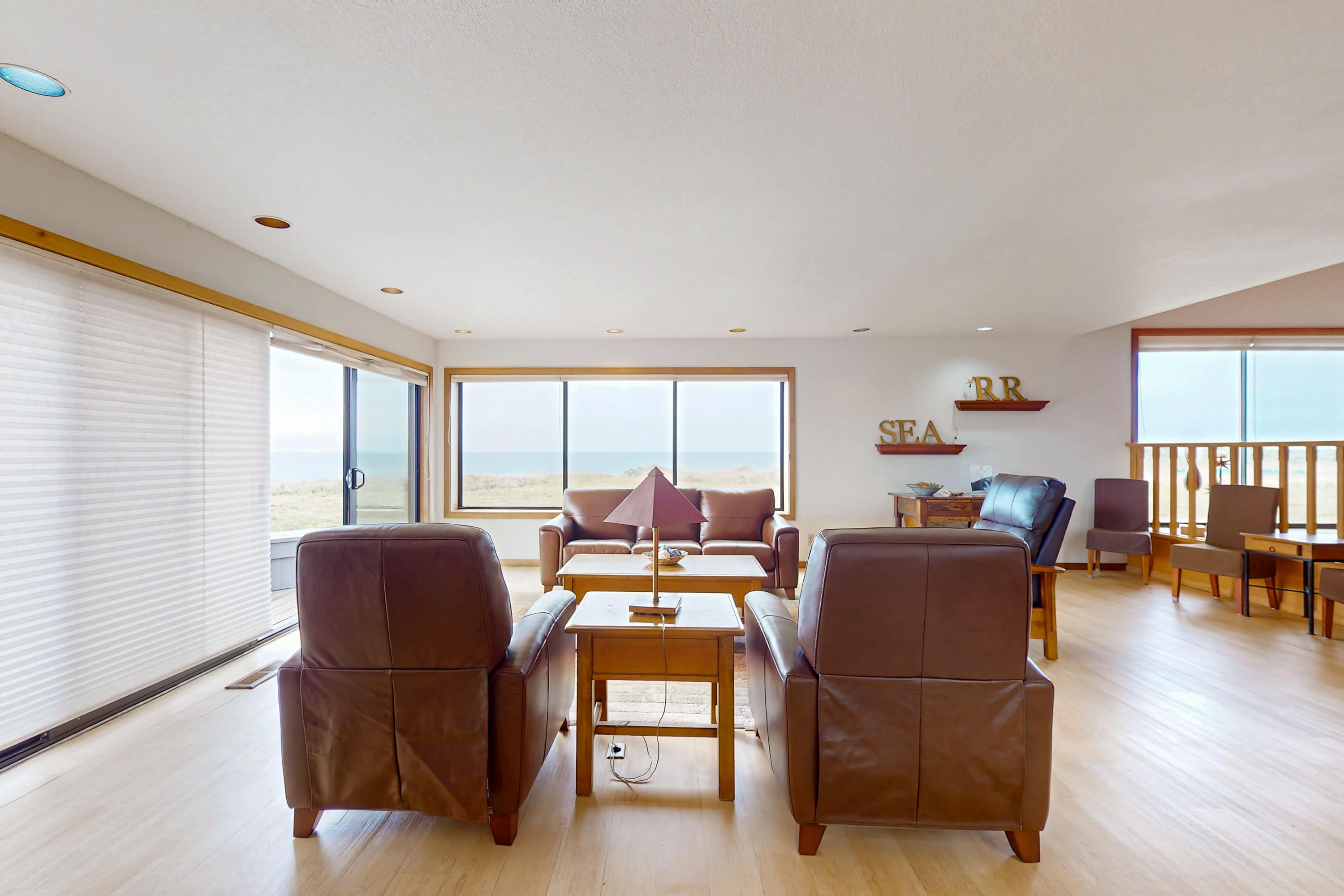 Imagine sipping your evening drink while gazing at the ocean from your comfortable seating area—pure relaxation awaits.
