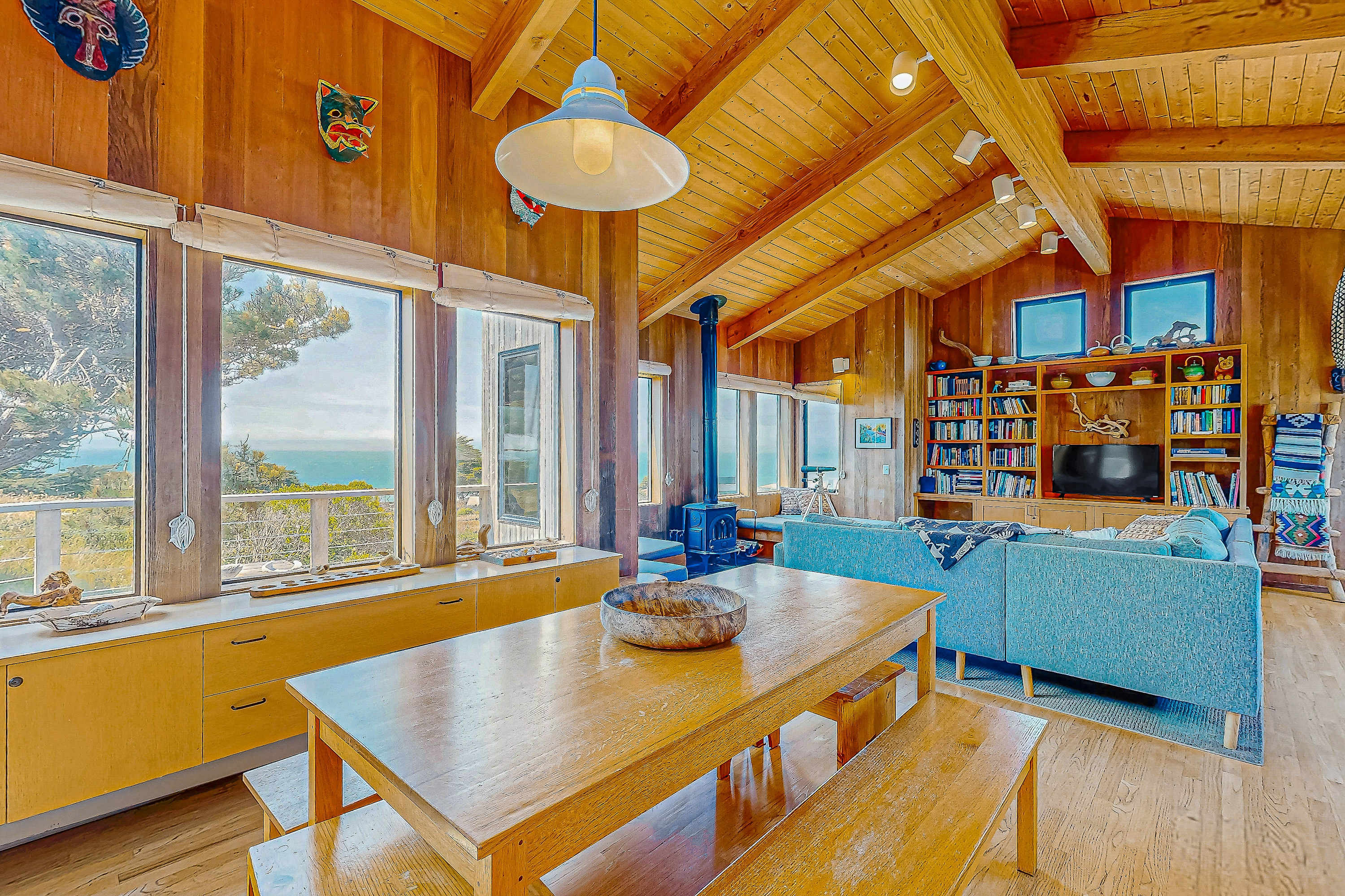 Gather around the fireplace in the living room, a perfect setting for cozy evenings filled with laughter.