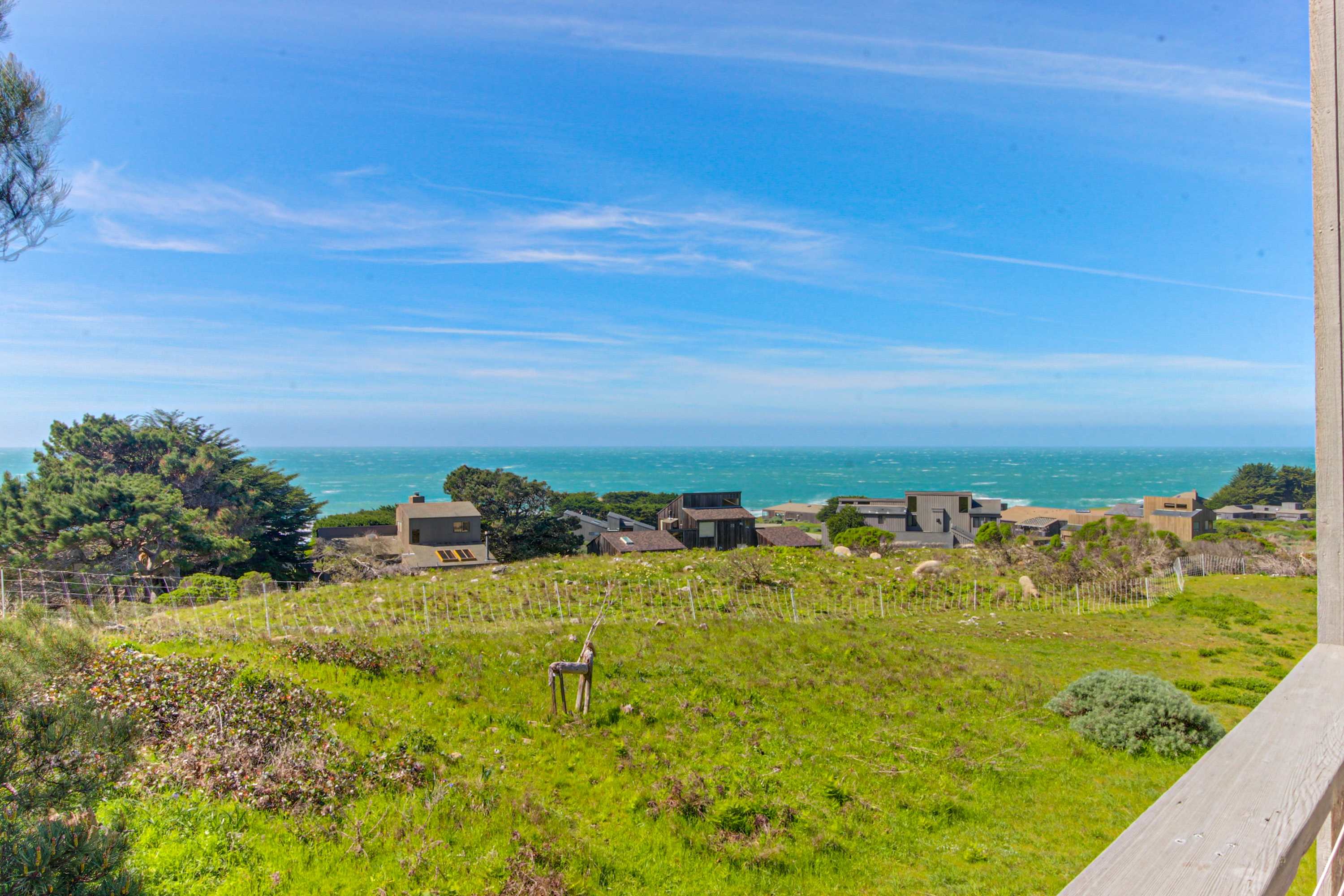 Gaze at breathtaking ocean views from the deck, where the horizon meets the lush greenery.