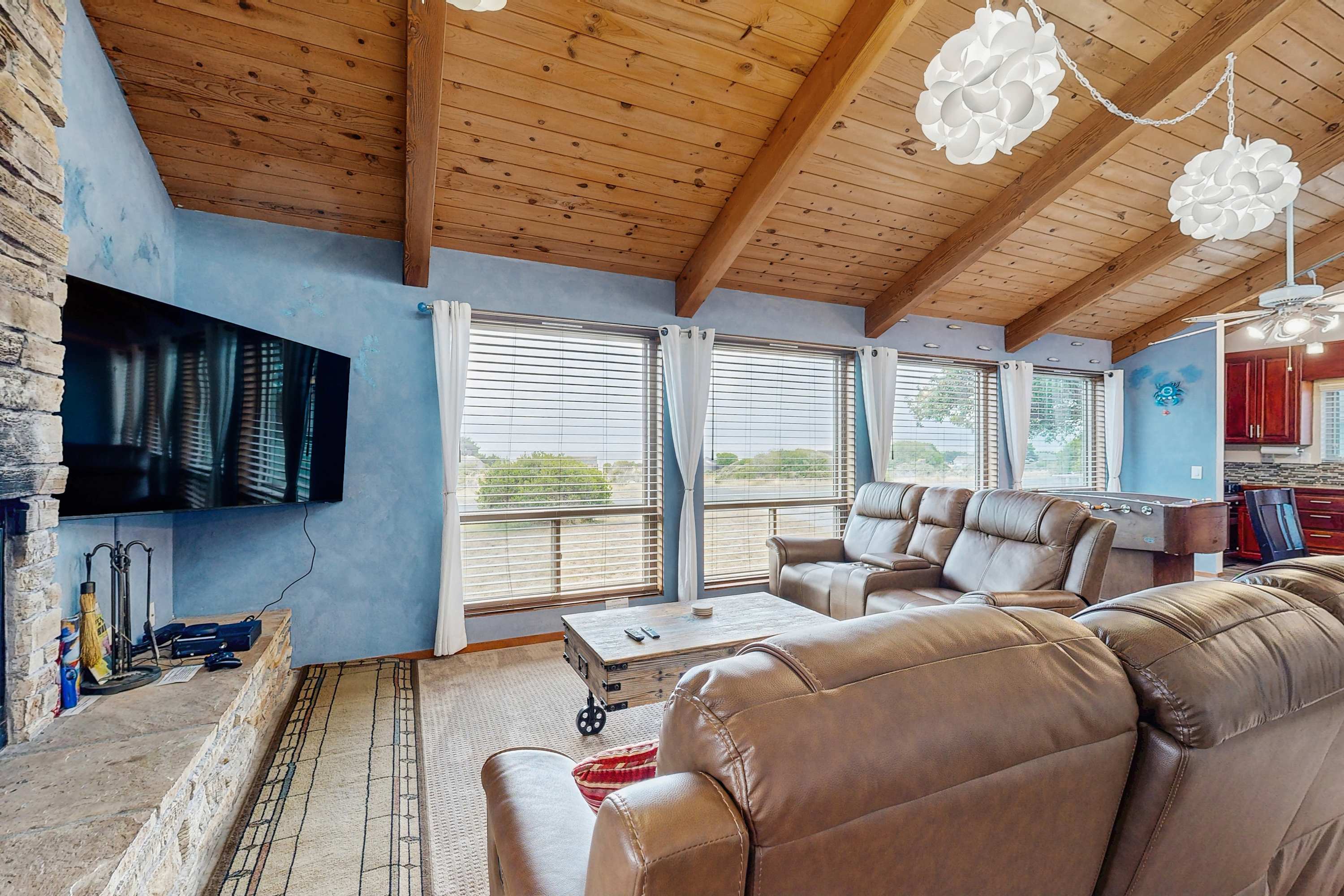 The living room is bathed in natural light, inviting you to curl up with a good book or enjoy a movie night with loved ones.