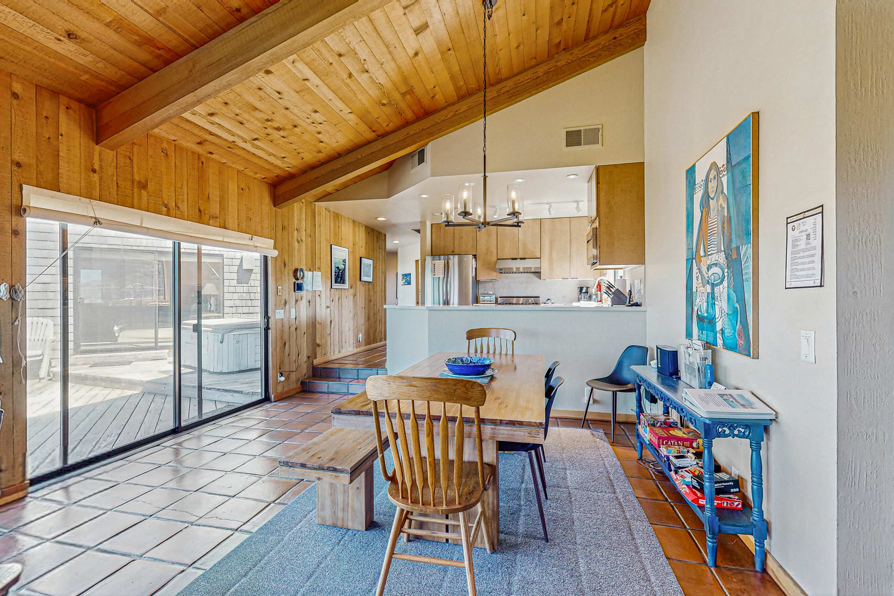 Picture your morning coffee shared at this dining table, with sunlight streaming through the windows, connecting you to the outdoors.