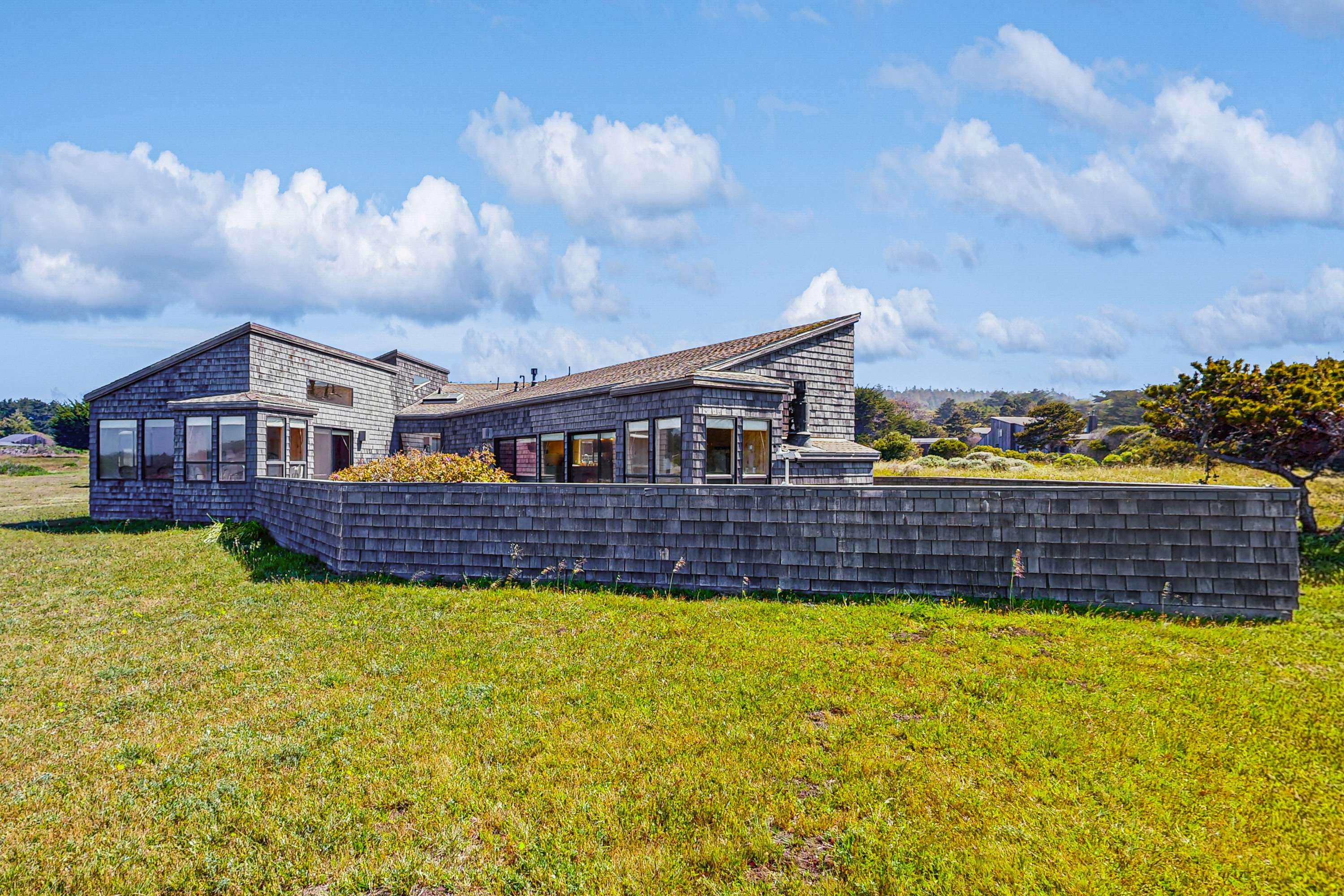 Welcome to Windrow Retreat, where coastal charm meets modern comfort. Your adventure begins here, surrounded by lush green landscapes.