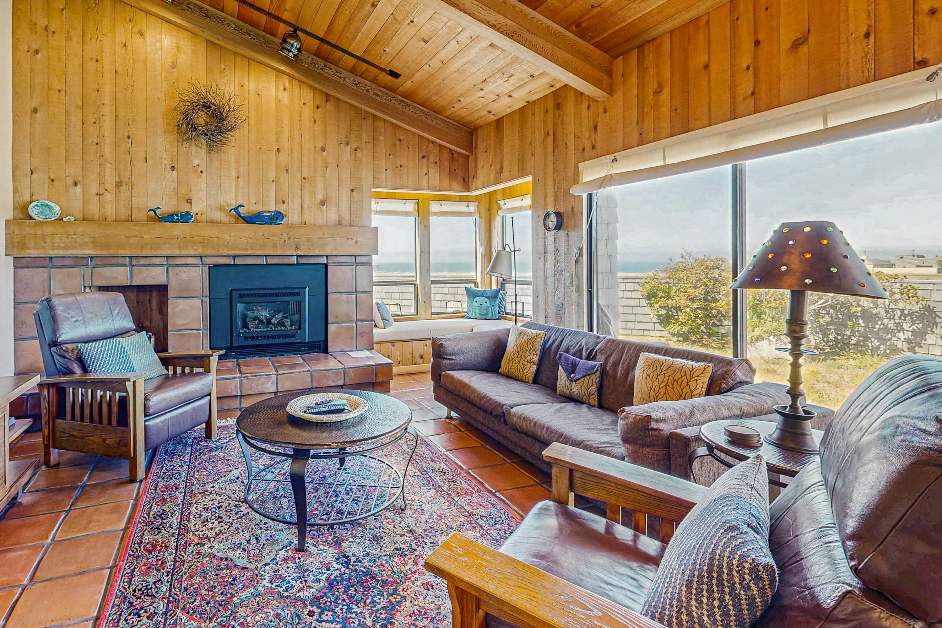 Gather around the cozy gas fireplace in the living room, where panoramic views invite relaxation and connection with loved ones.