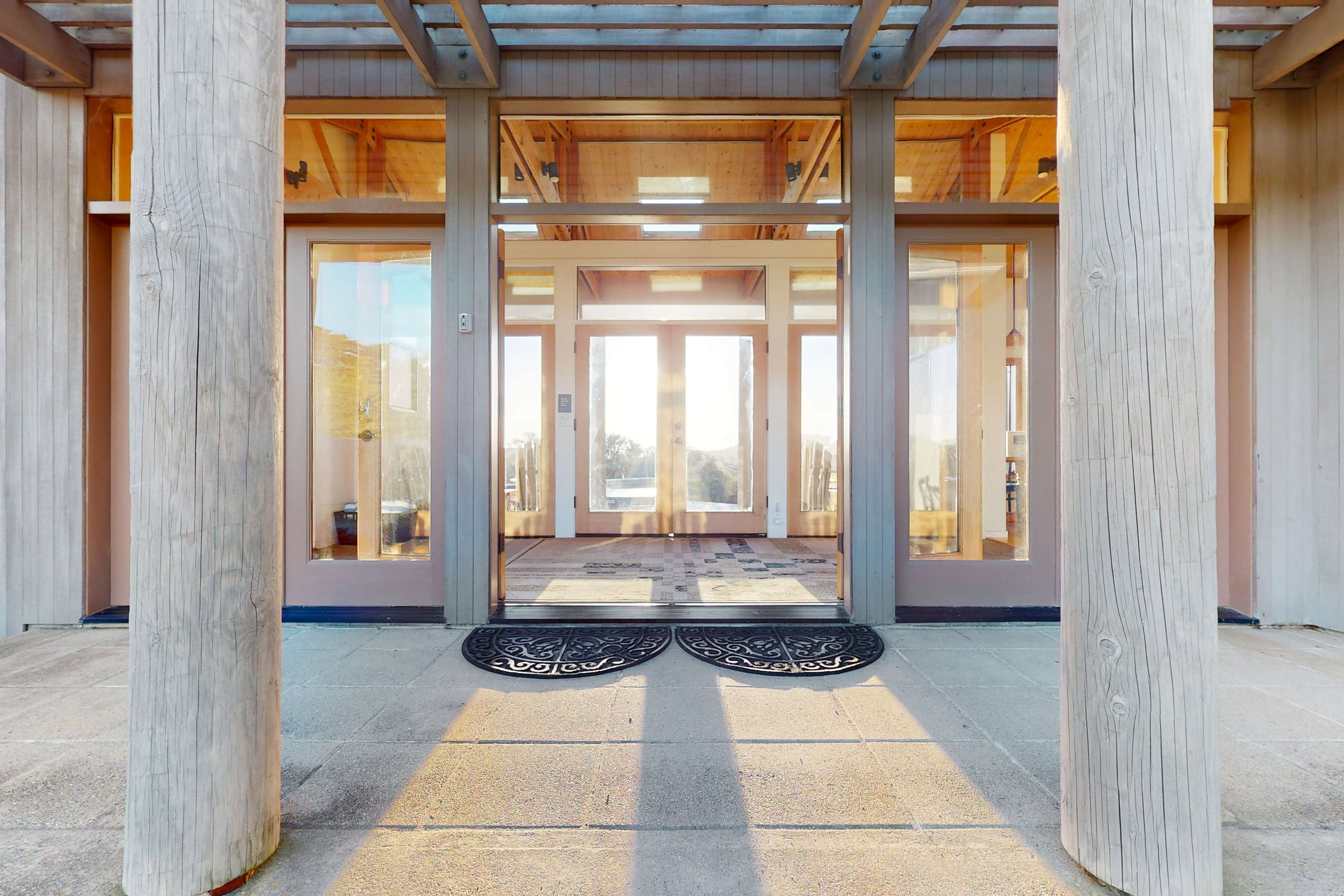 Step into a warm welcome at Del Mar Meadow, where the inviting entryway sets the tone for your coastal retreat.