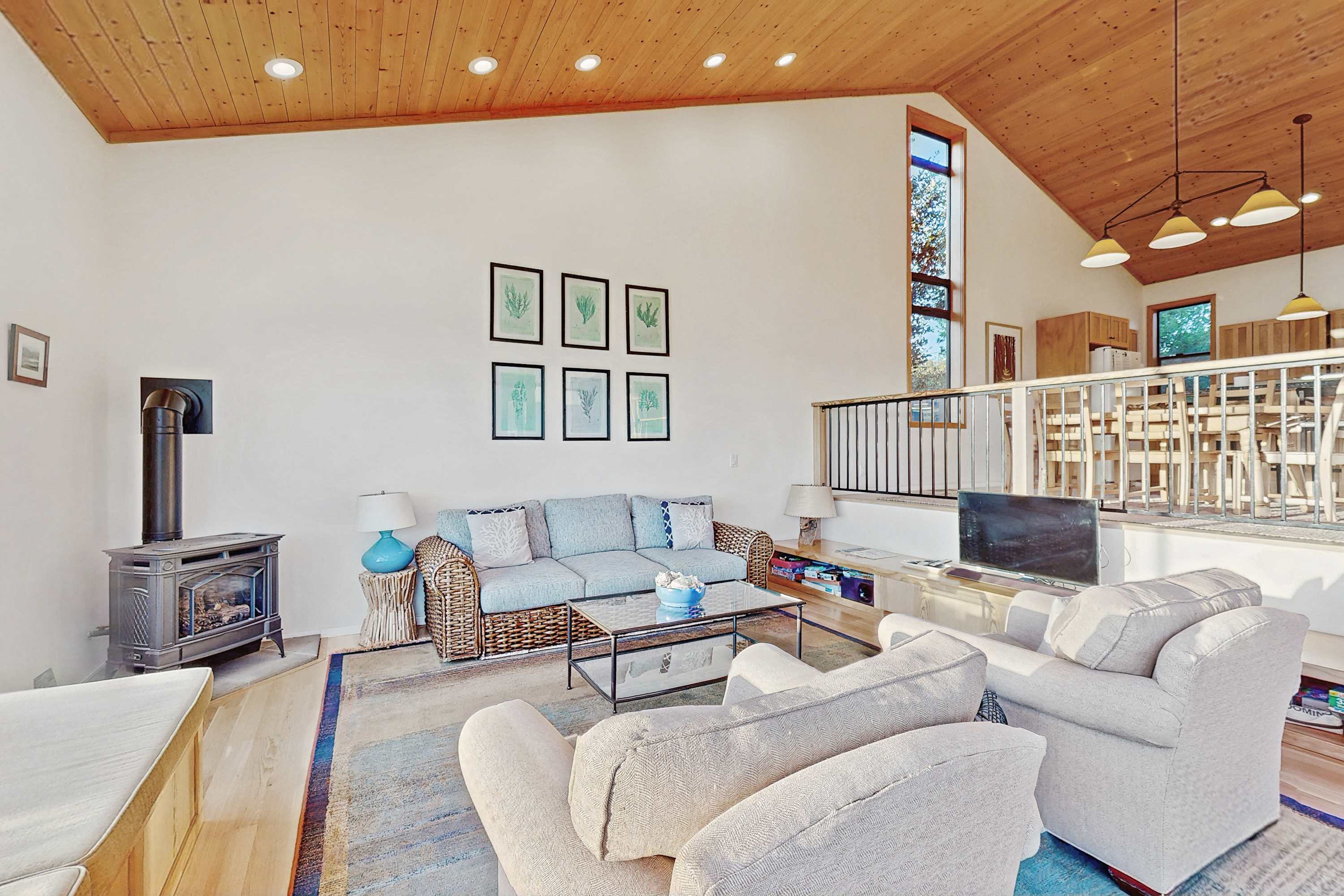 Gather in the cozy living room, where a gas fireplace adds warmth and charm, making it an inviting space for family and friends.