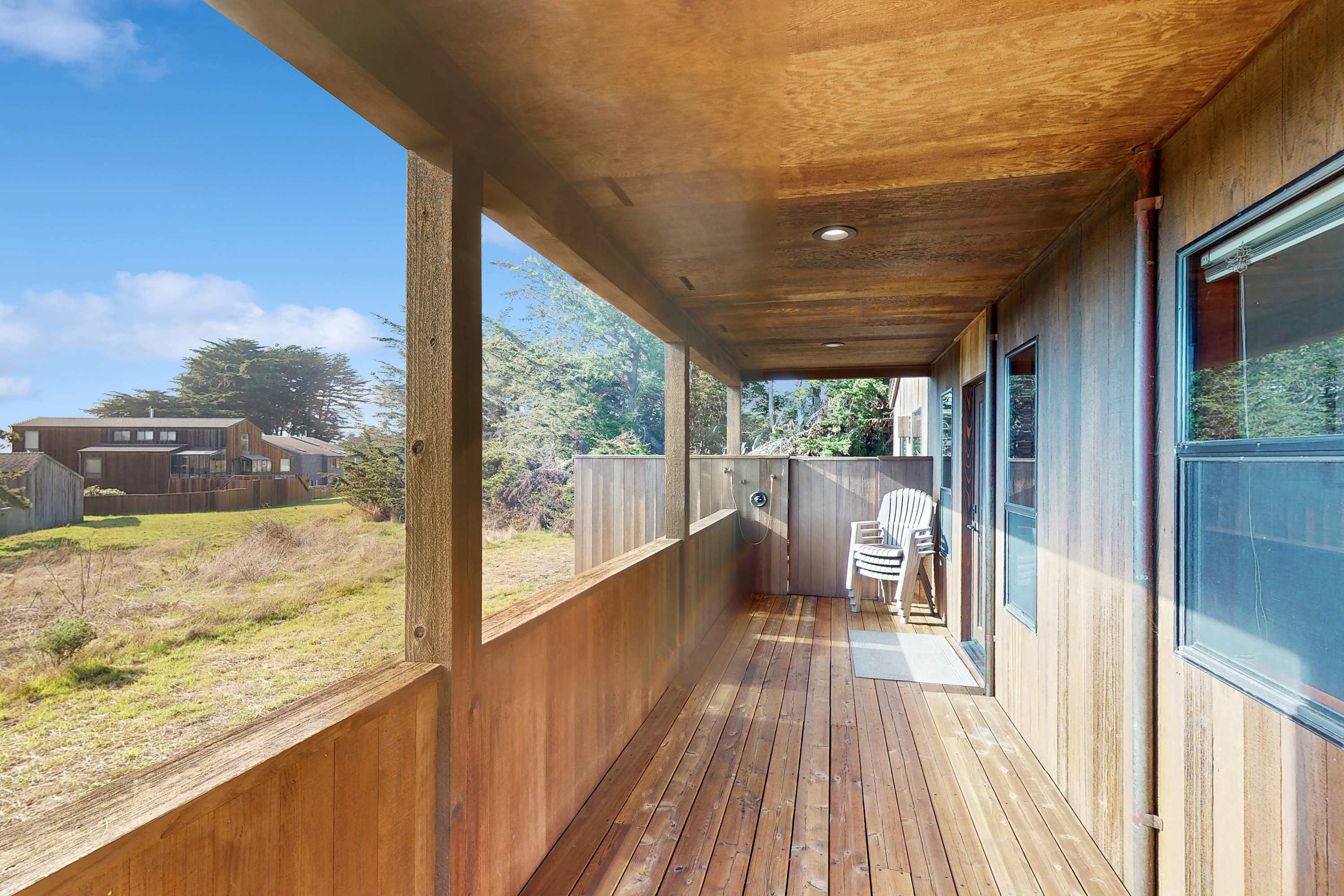 Perfect for lazy afternoons, this spacious deck invites you to unwind with a good book or share laughter with friends.