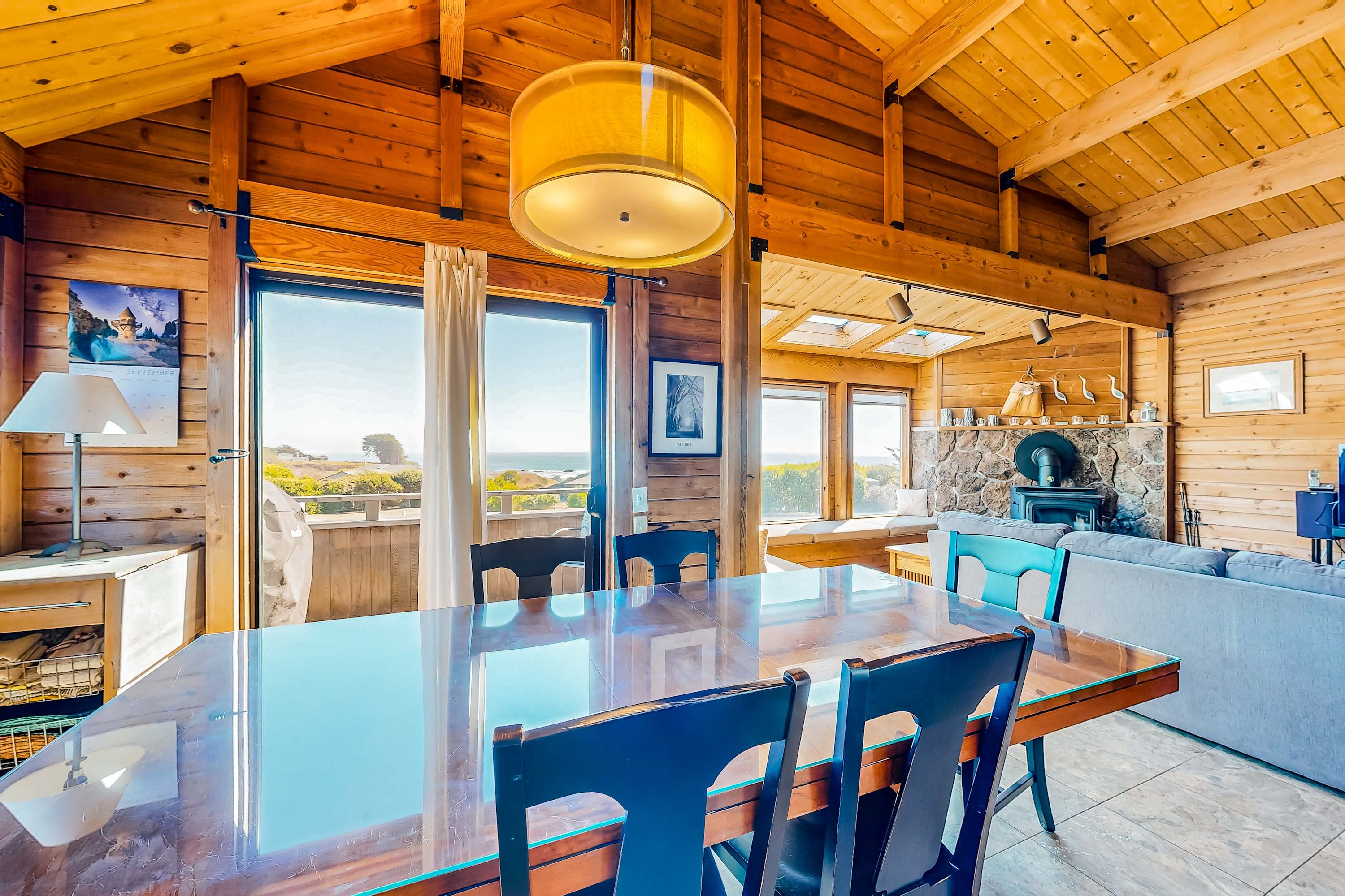 Savor your morning coffee at this dining area, where sunlight dances through the windows and the ocean calls.
