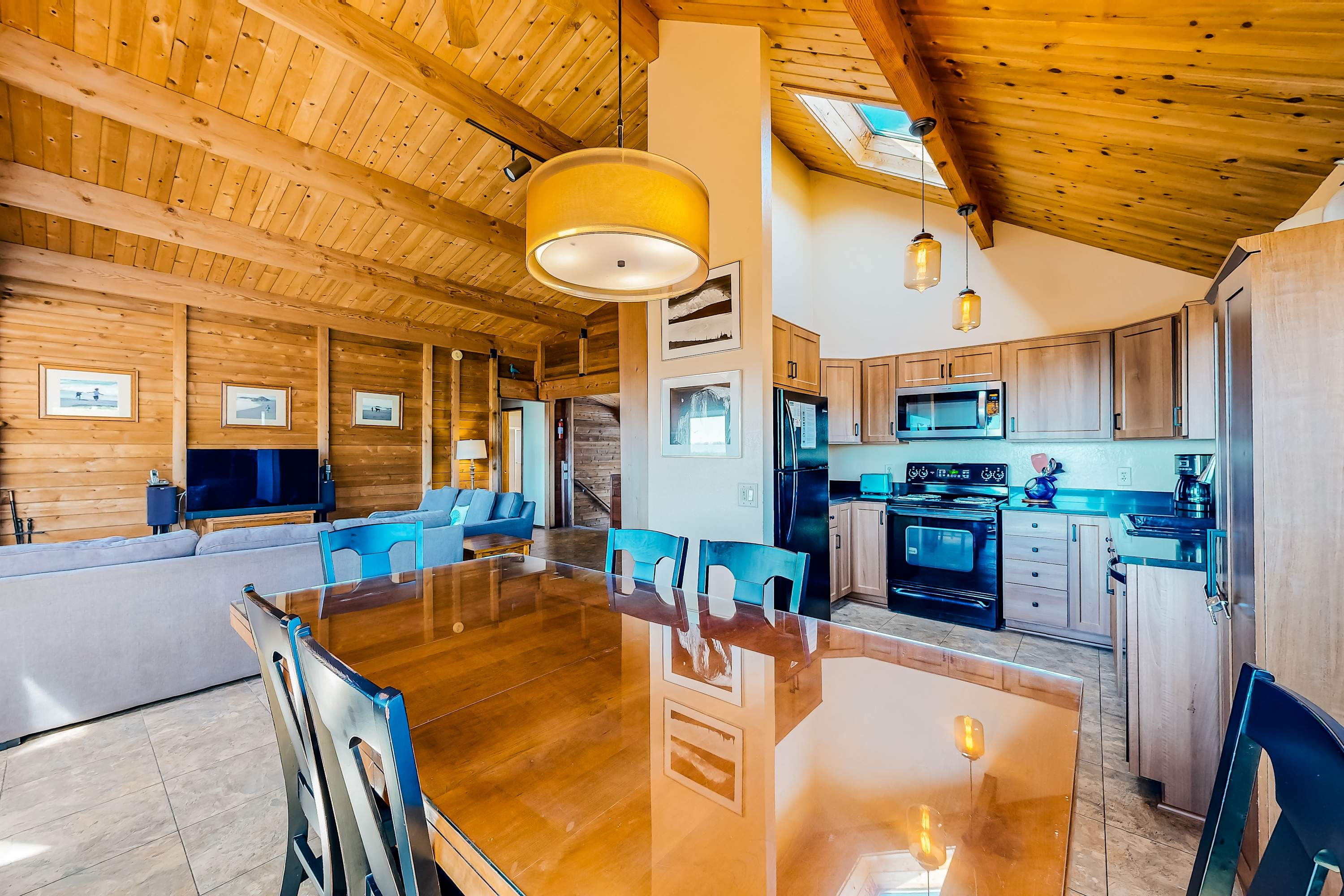 Craft culinary delights in a well-appointed kitchen that blends functionality with coastal charm for your family feasts.