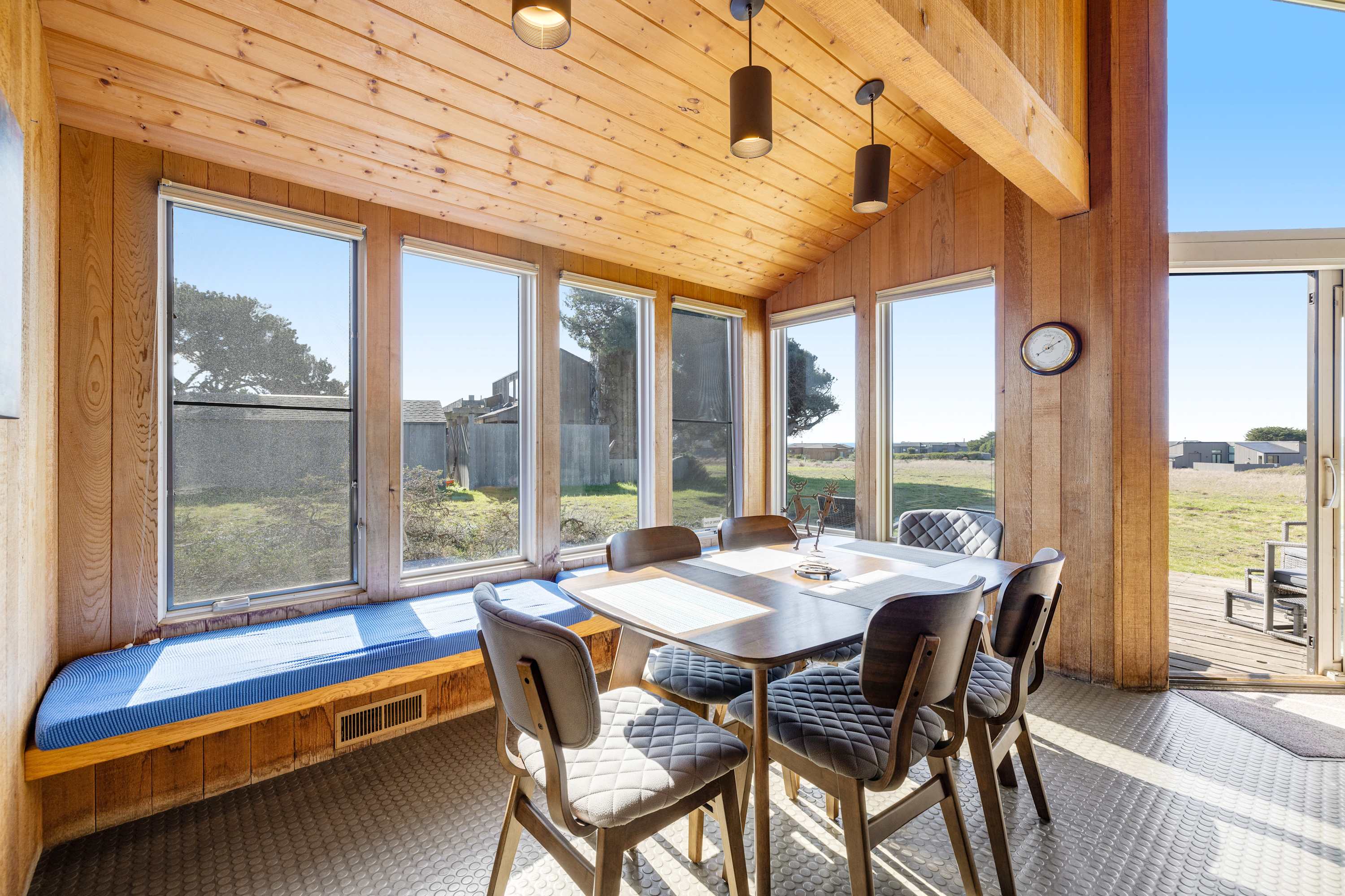 Share meals and laughter in the dining area, where large windows frame the picturesque scenery, making every meal a special occasion.
