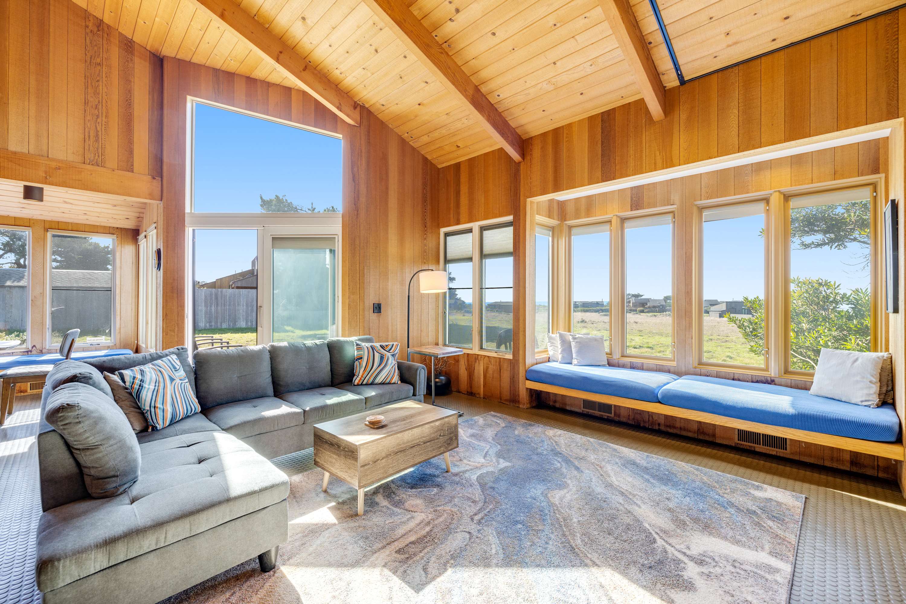 Morning light fills the spacious living room, creating a warm and inviting space for family gatherings or quiet reflection.