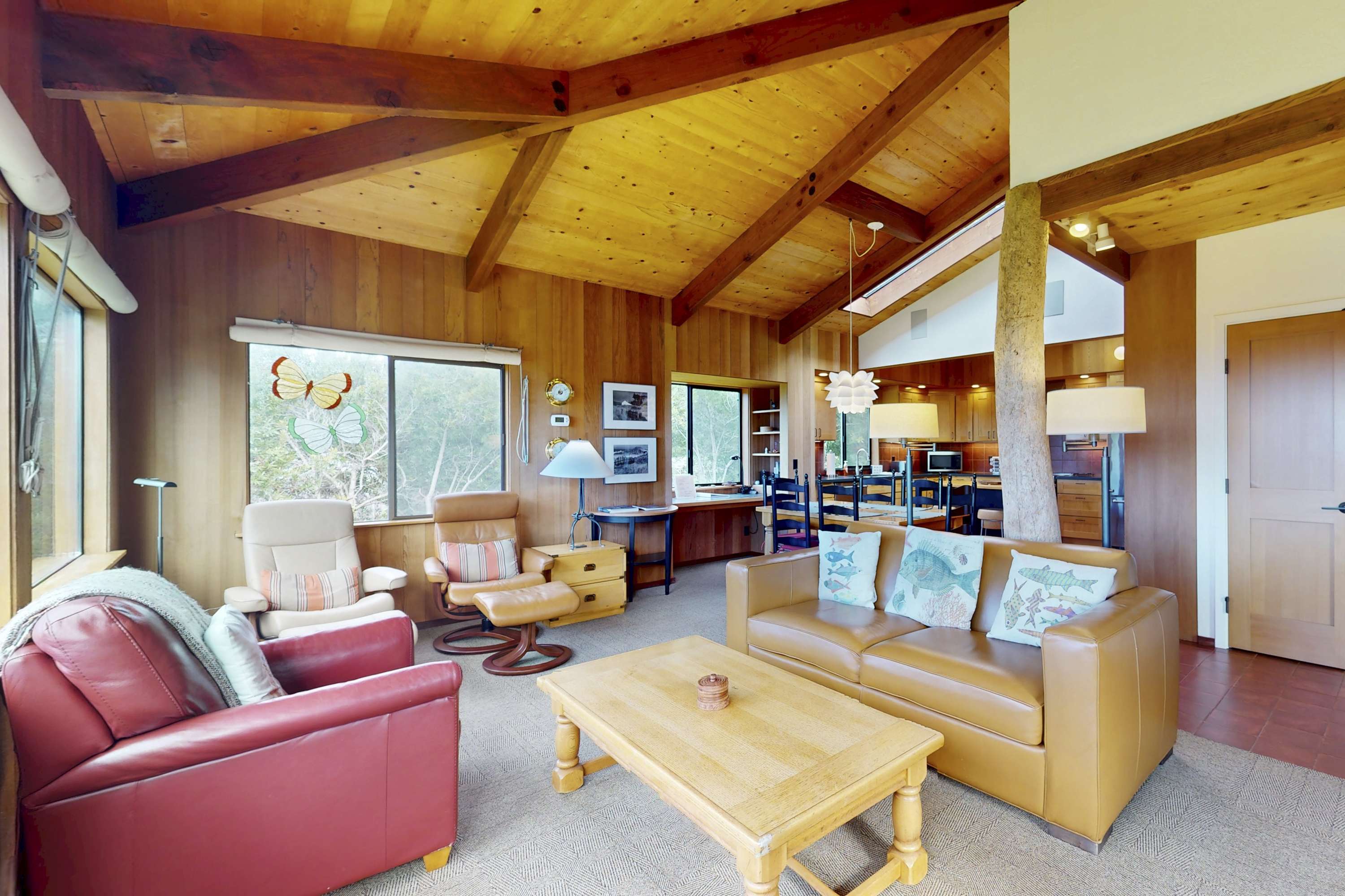 The inviting living area beckons you to gather with loved ones, featuring a warm ambiance and stunning natural light.