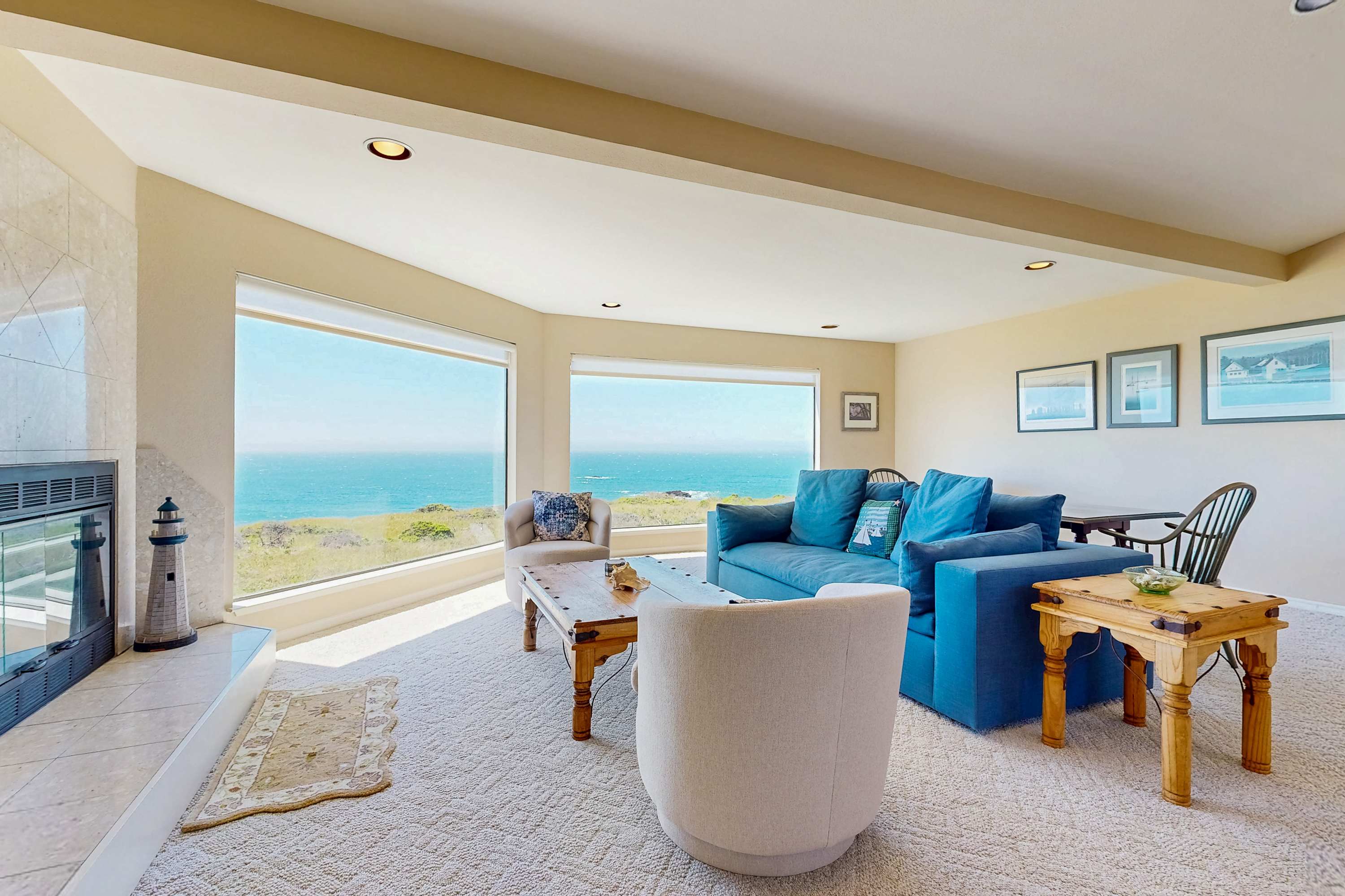 Bask in the natural light of the spacious living room, where ocean views inspire relaxation and cozy gatherings.