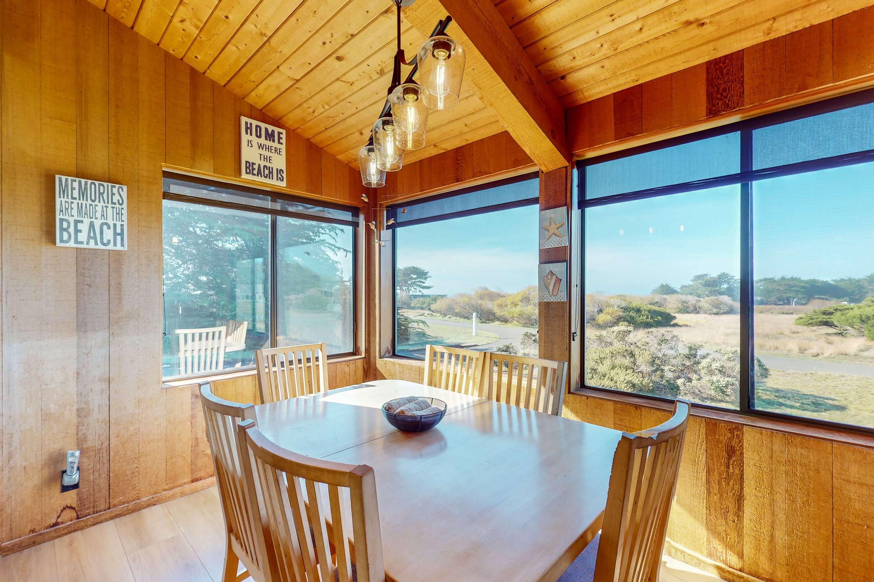 Dine with a view! The dining area features large windows that frame the picturesque landscape, creating a memorable setting for family meals.