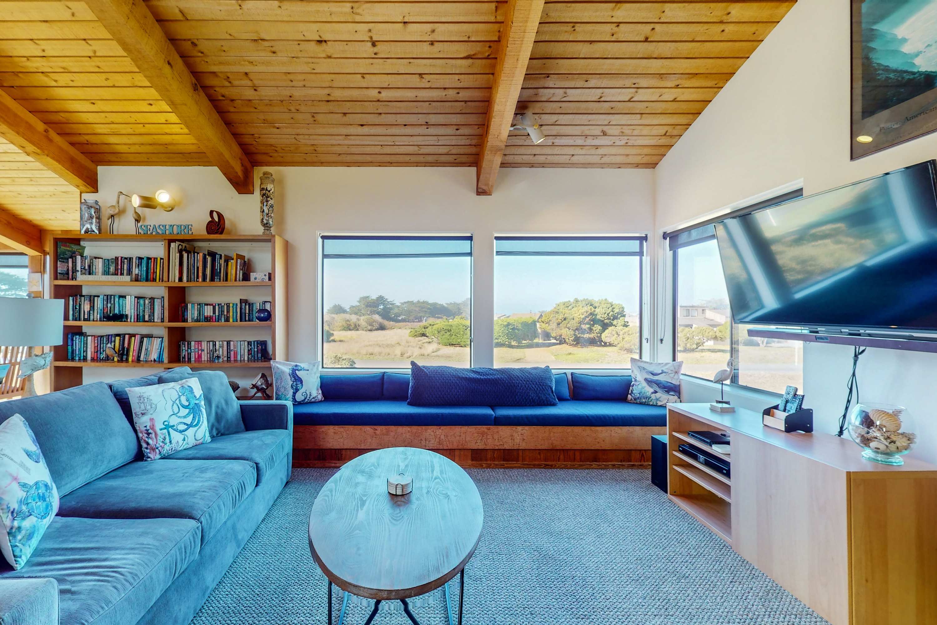 Morning light fills this living space, offering the perfect spot for leisurely afternoons spent watching the waves from the comfort of your couch.