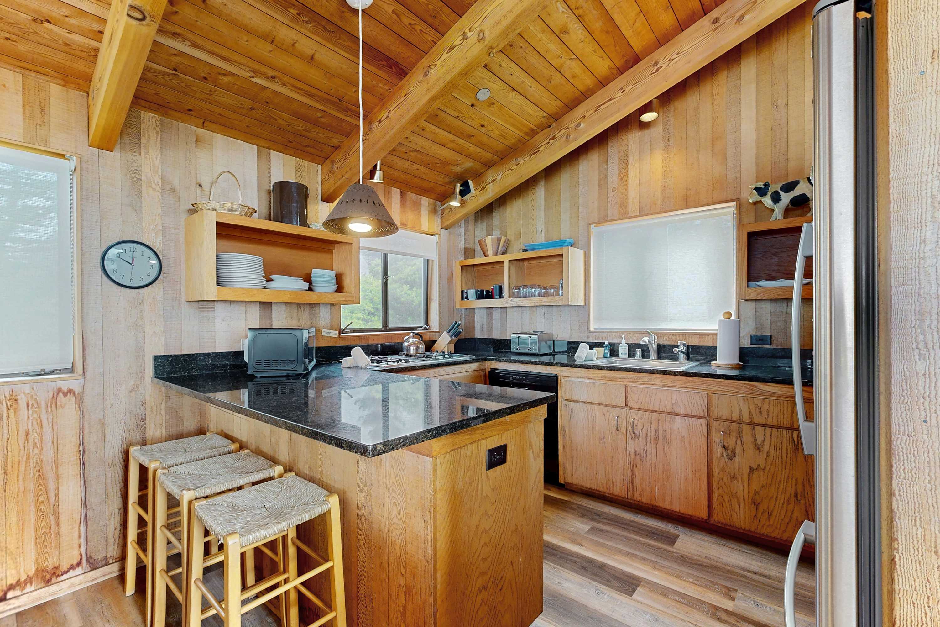 Craft culinary delights in this well-appointed kitchen, featuring modern appliances and ample counter space for your favorite recipes.