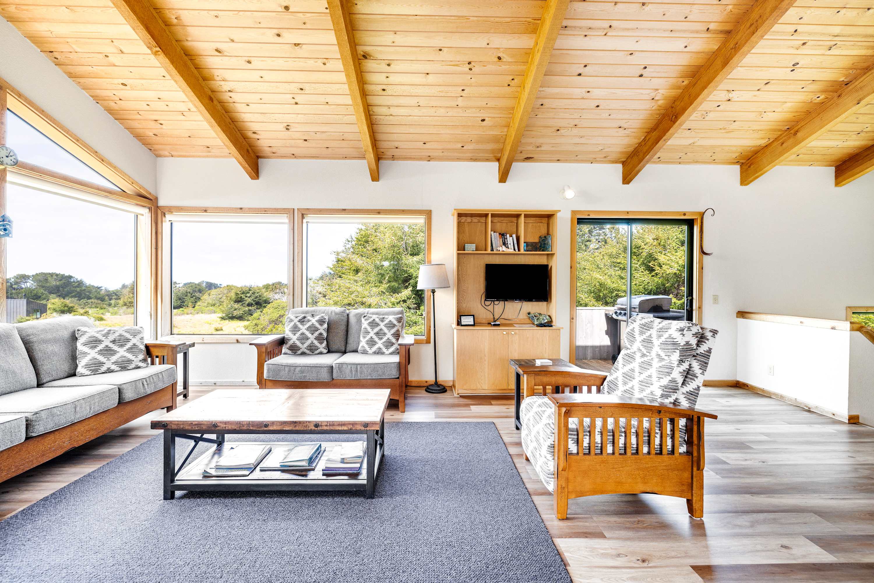 Bask in panoramic views from your living room, where large windows frame the beauty of Sea Ranch’s natural landscape.