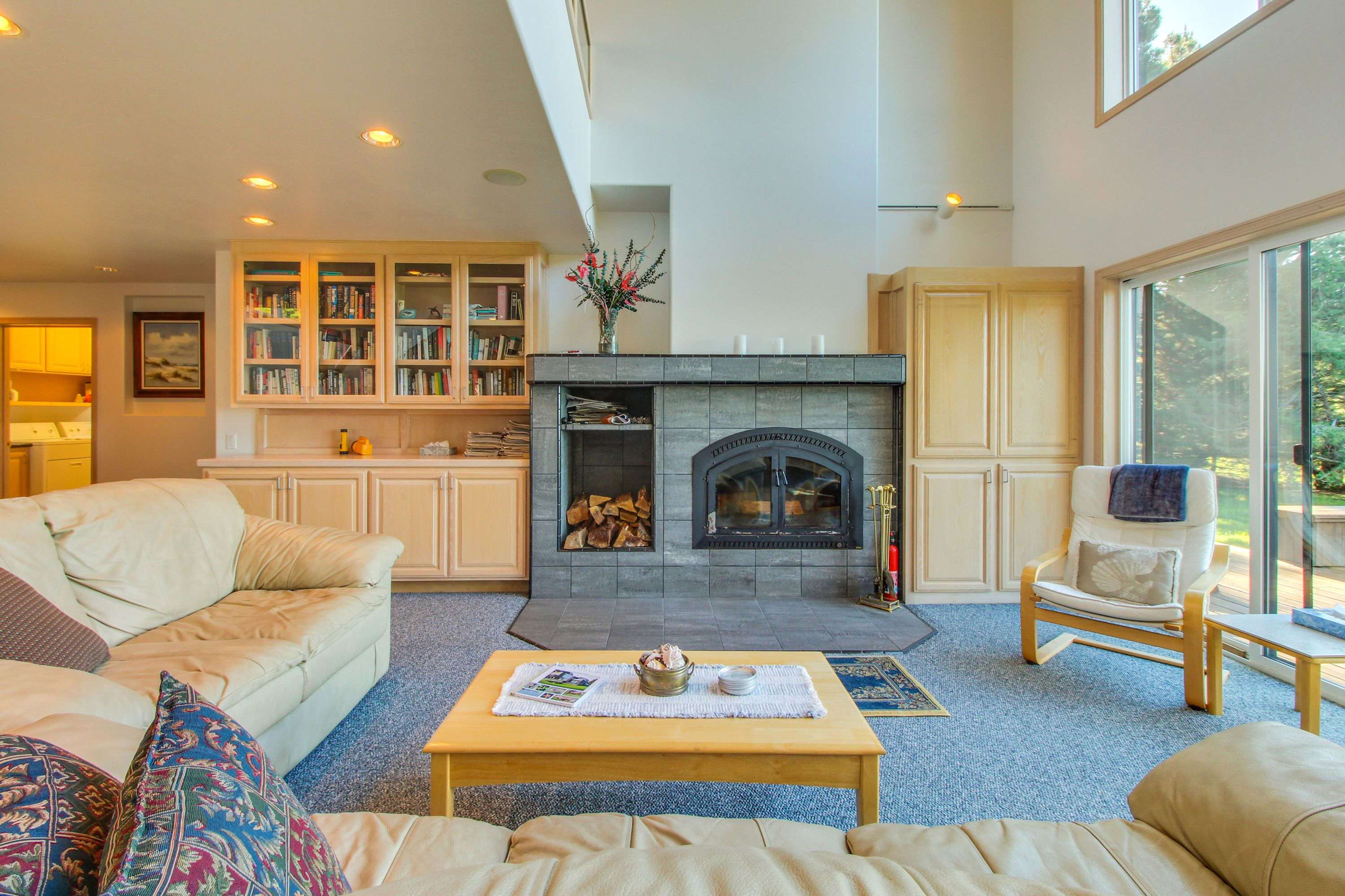 Gather around the wood-burning fireplace in the cozy living room, a perfect spot for storytelling and warmth after a day of exploration.