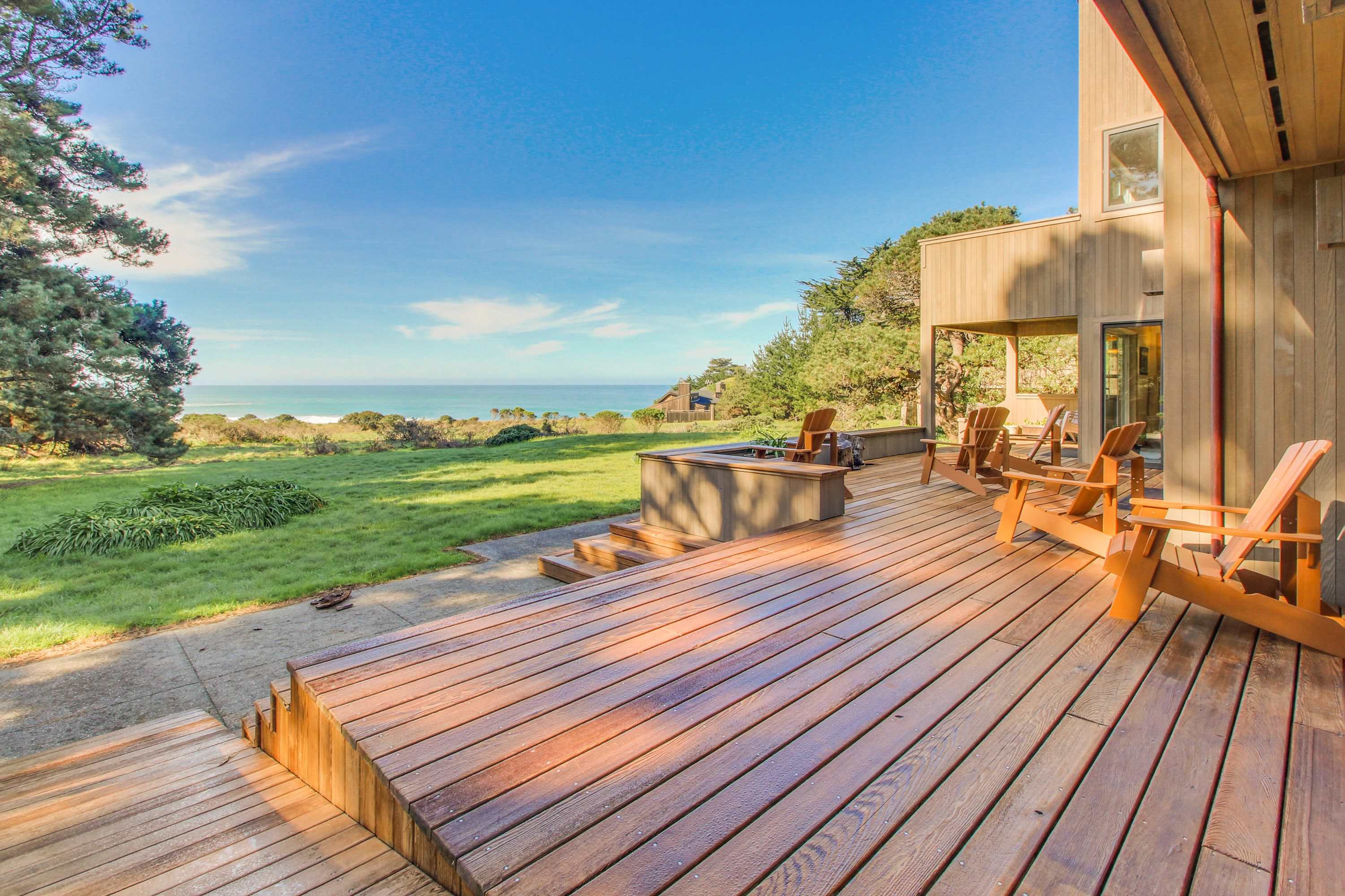 The outdoor deck invites you to savor sunset views, equipped for leisurely evenings or lively gatherings with loved ones.