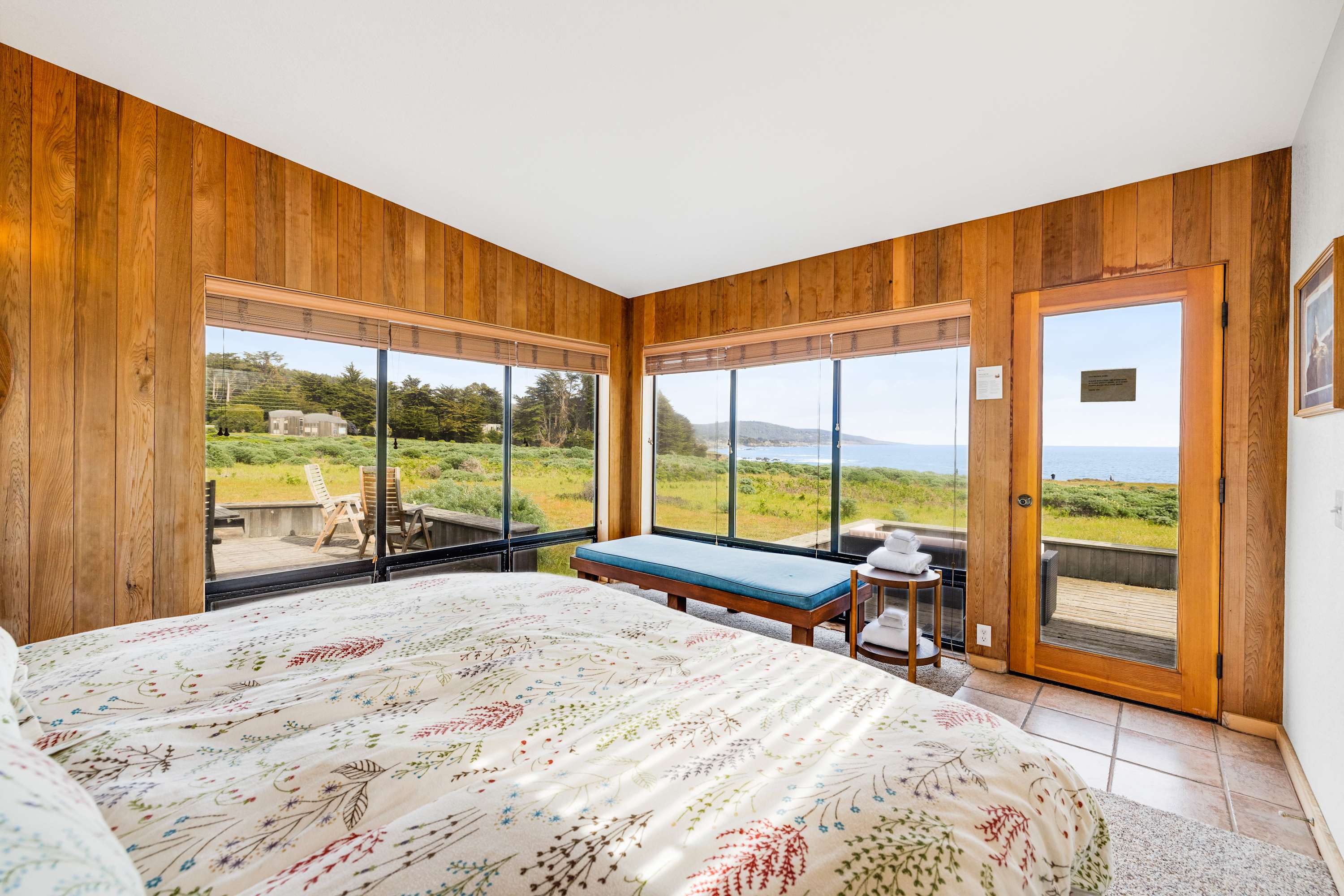 Breathe in the coastal air from your master suite, featuring expansive windows that frame breathtaking ocean views.