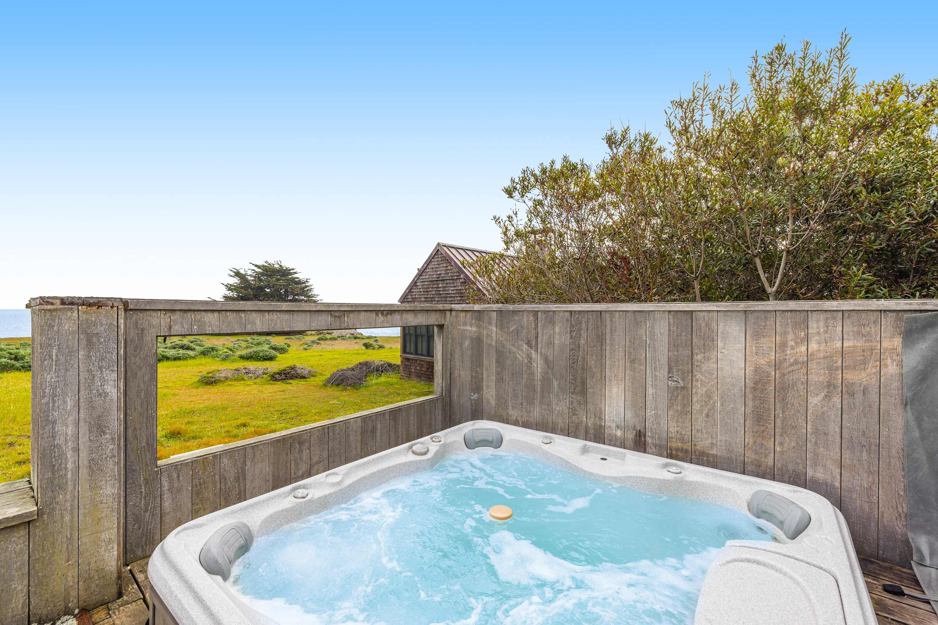 Relax in the hot tub, where the warm bubbles and stunning ocean views create a perfect retreat after a day of adventure.