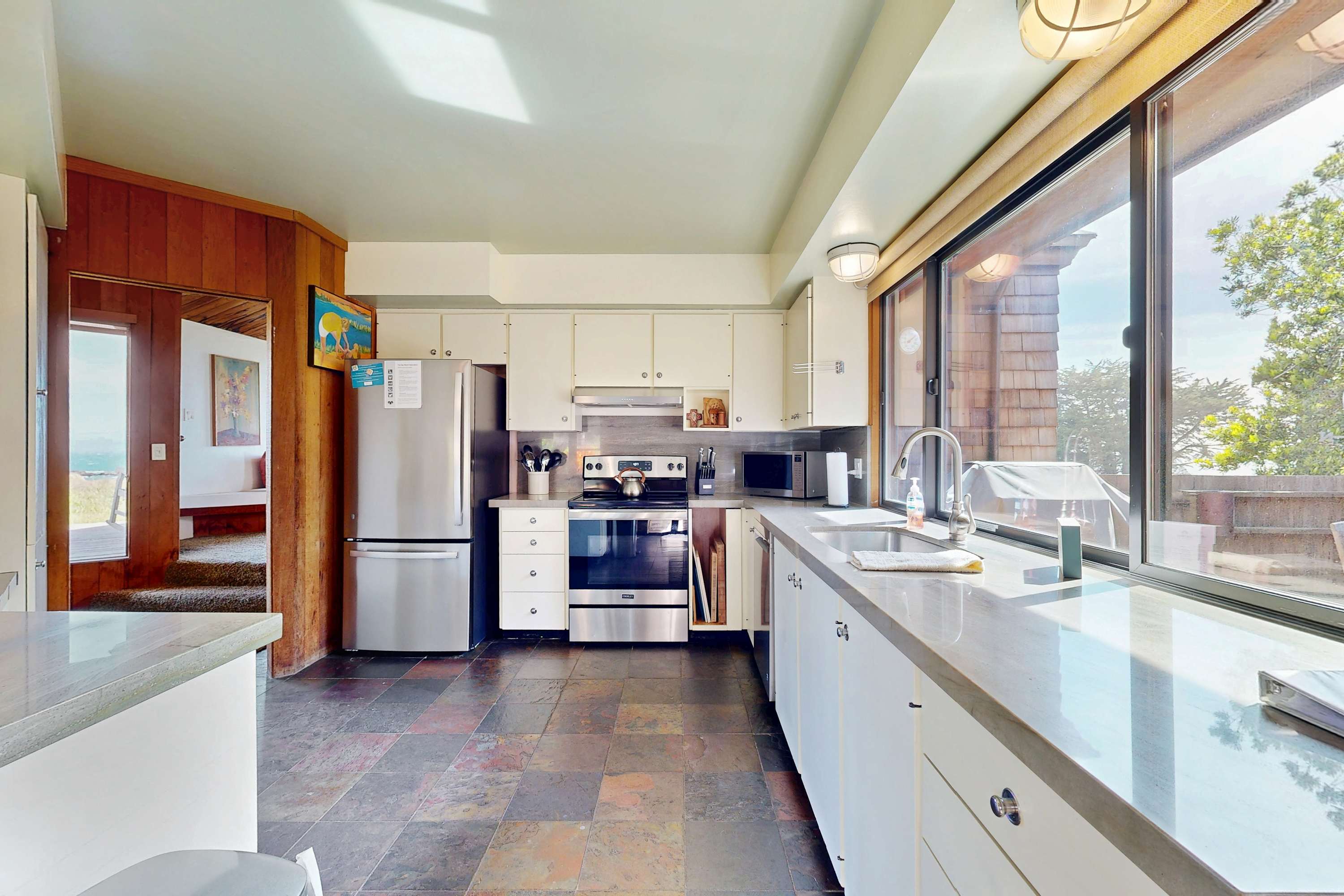 Cook up your favorite meals in the modern kitchen, equipped with everything you need to create culinary delights while enjoying ocean views.