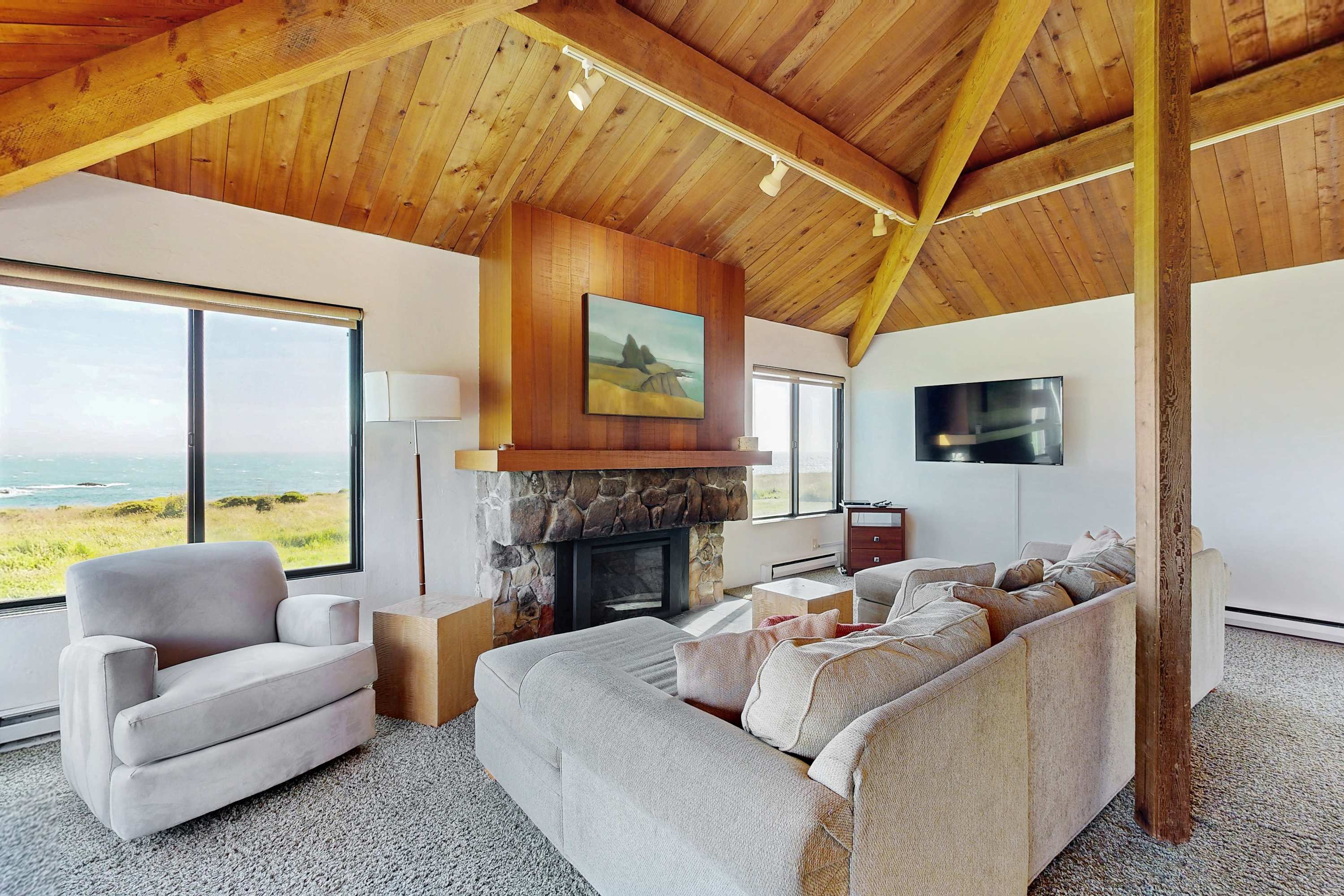 The cozy living room features a perfect blend of comfort and style, designed for cozy evenings and stunning sunset views.