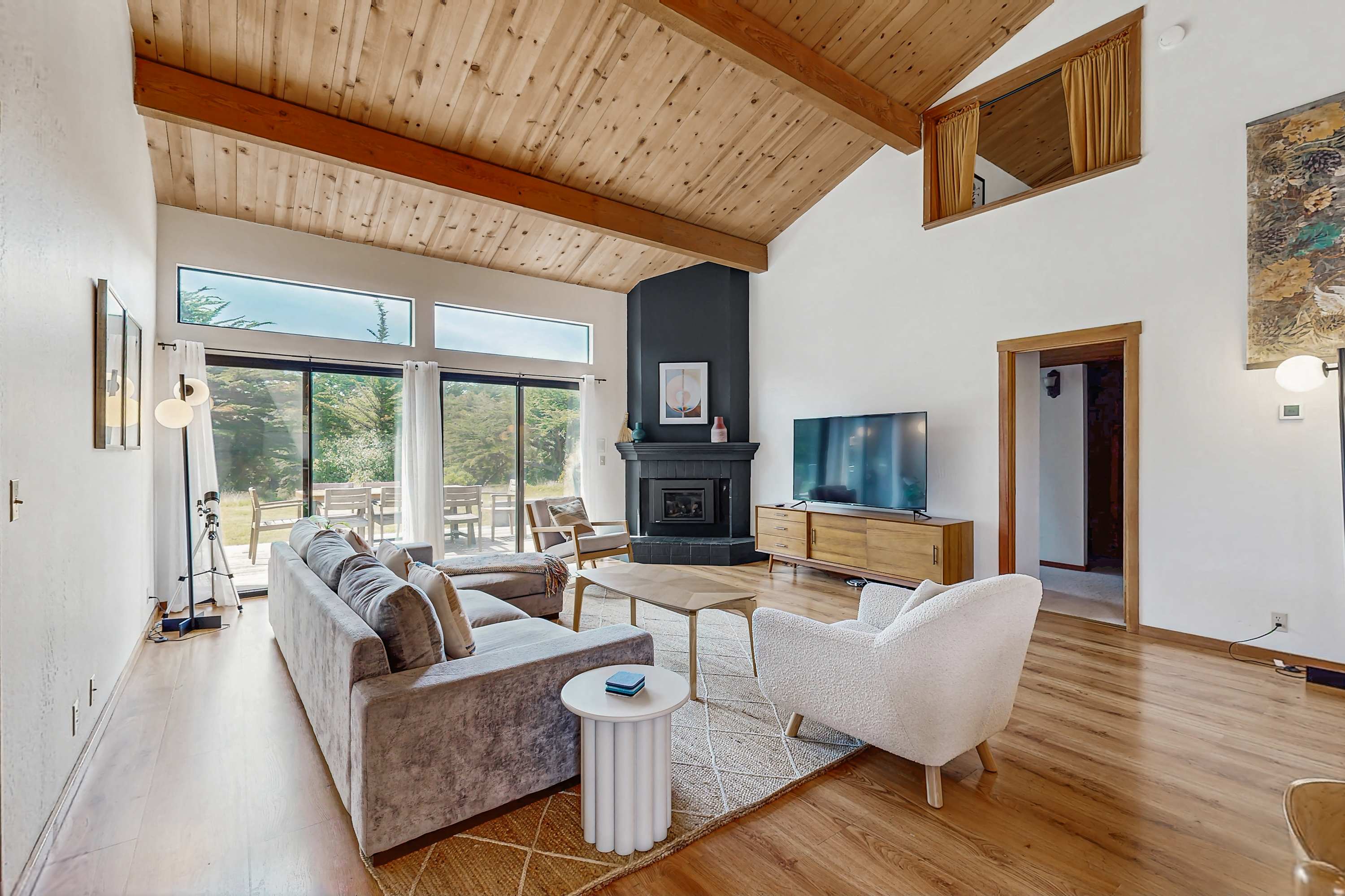 Gather around the gas fireplace in the cozy living room, perfect for unwinding after a day of adventure.