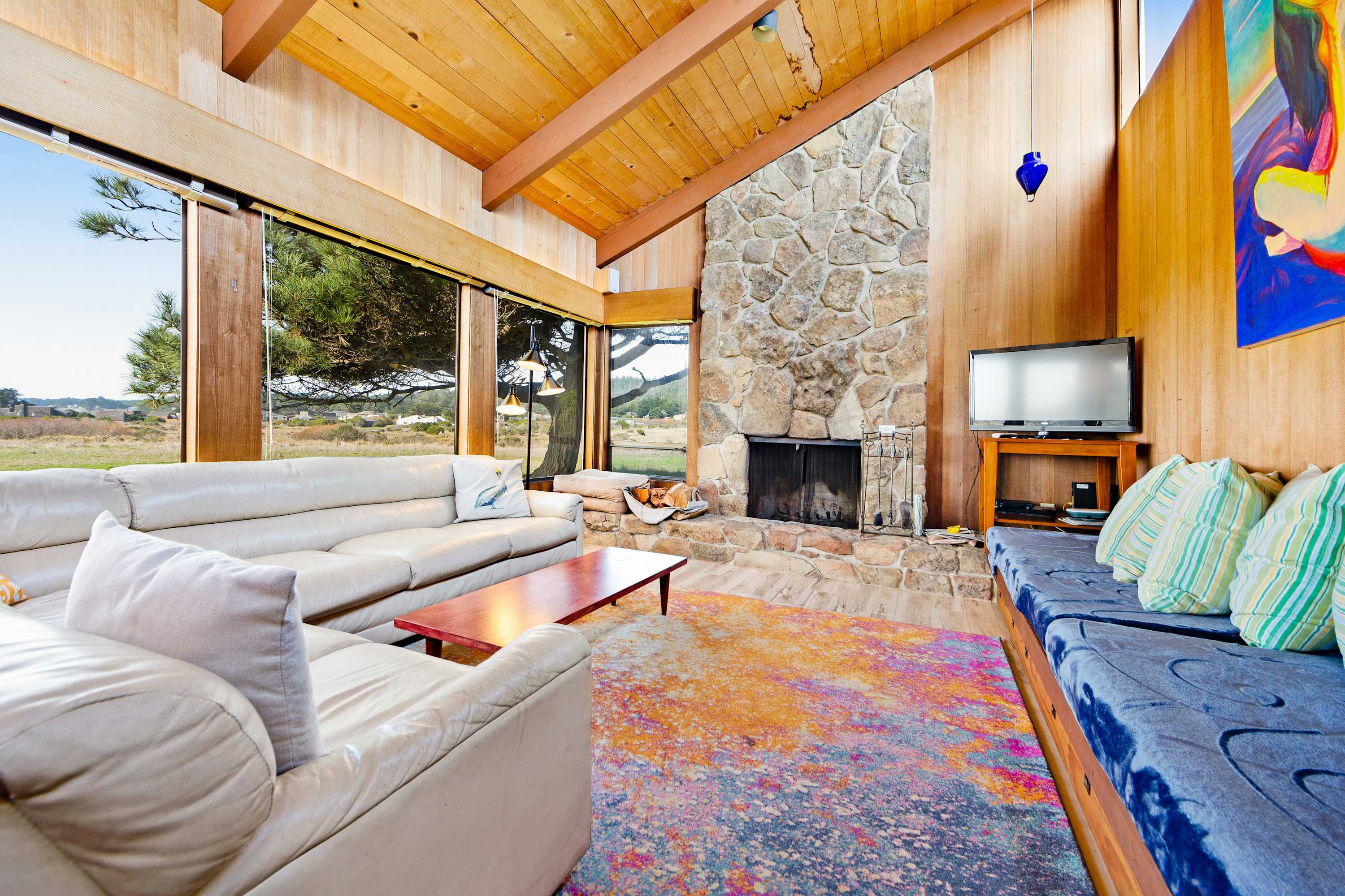 Cozy up by the wood-burning fireplace in this beautifully designed living space, perfect for creating lasting memories after a day of adventure.
