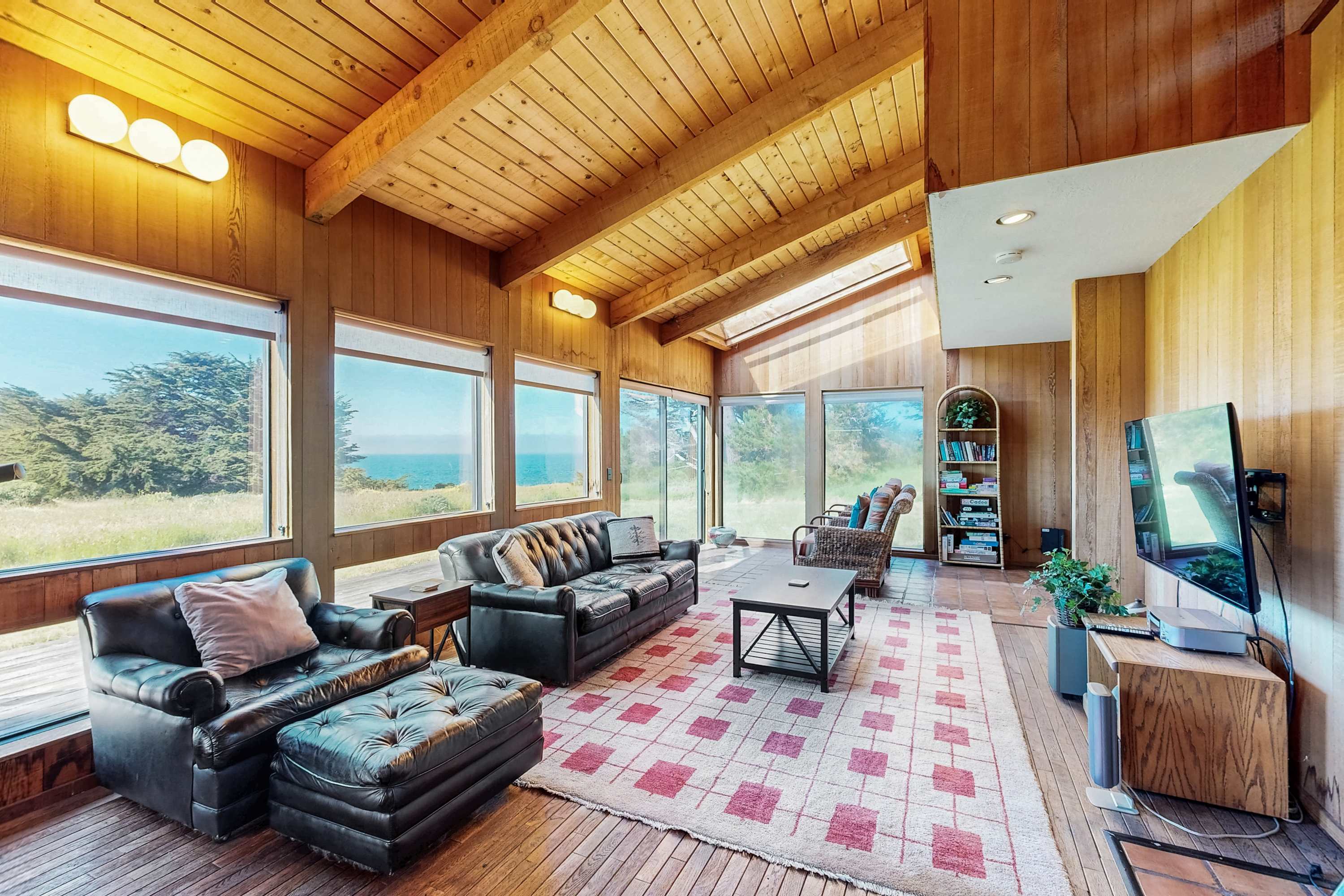 Morning light fills the spacious living room, where you can enjoy panoramic views and cozy gatherings with loved ones.
