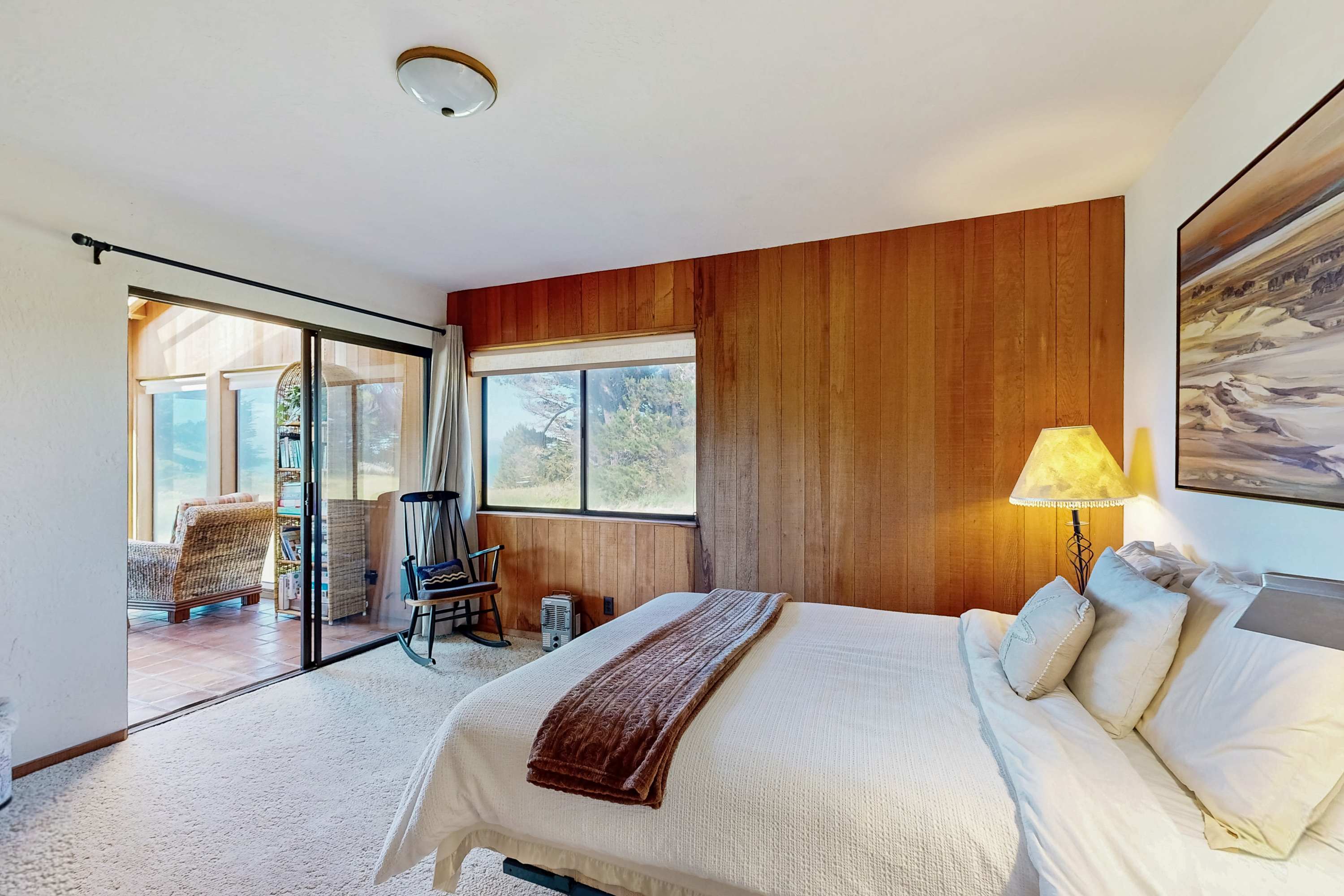 Retreat to the master bedroom, where natural wood accents and serene decor create a peaceful atmosphere for restful nights.