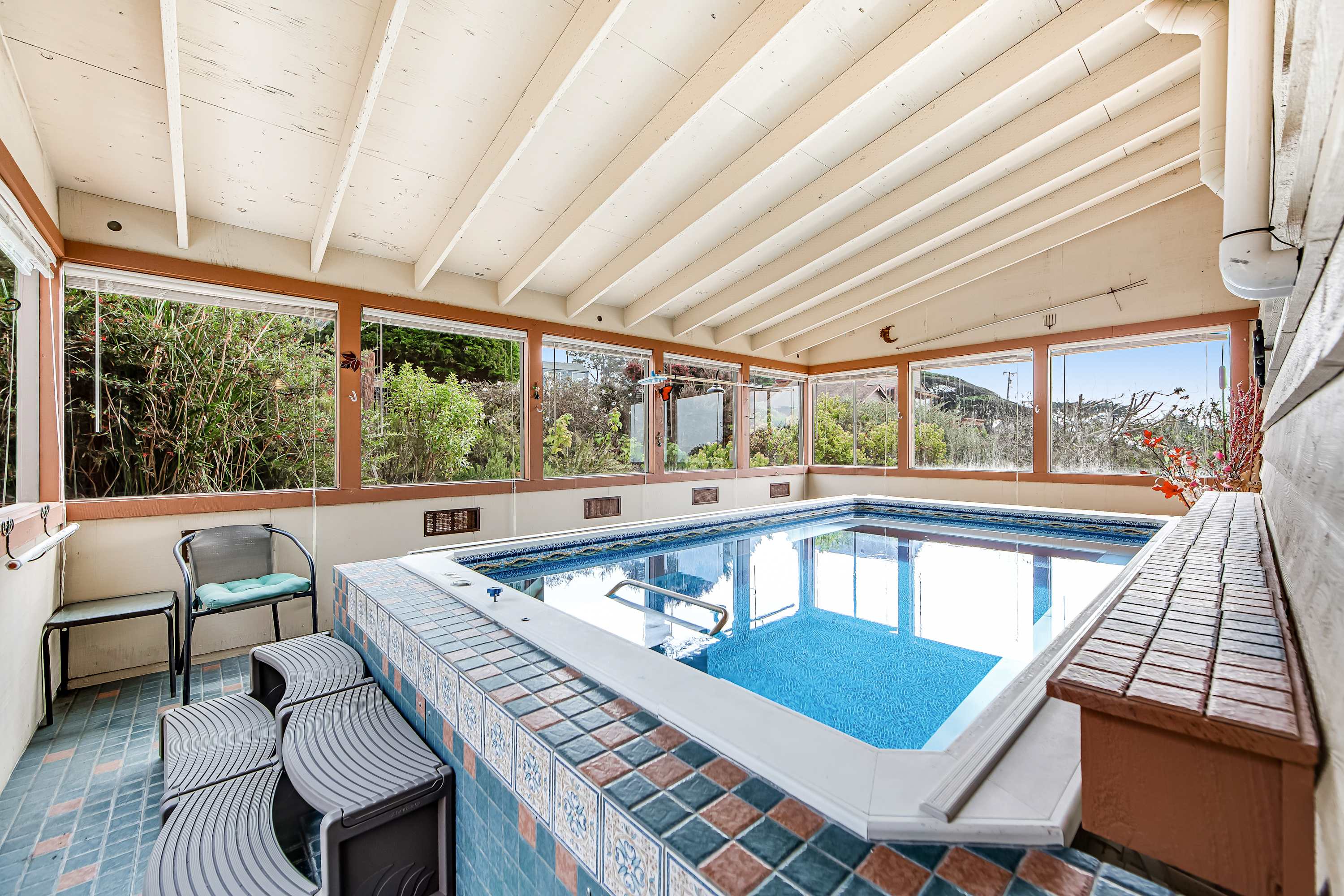 Enter this serene indoor pool, where relaxation meets breathtaking views, perfect for a swim any time.