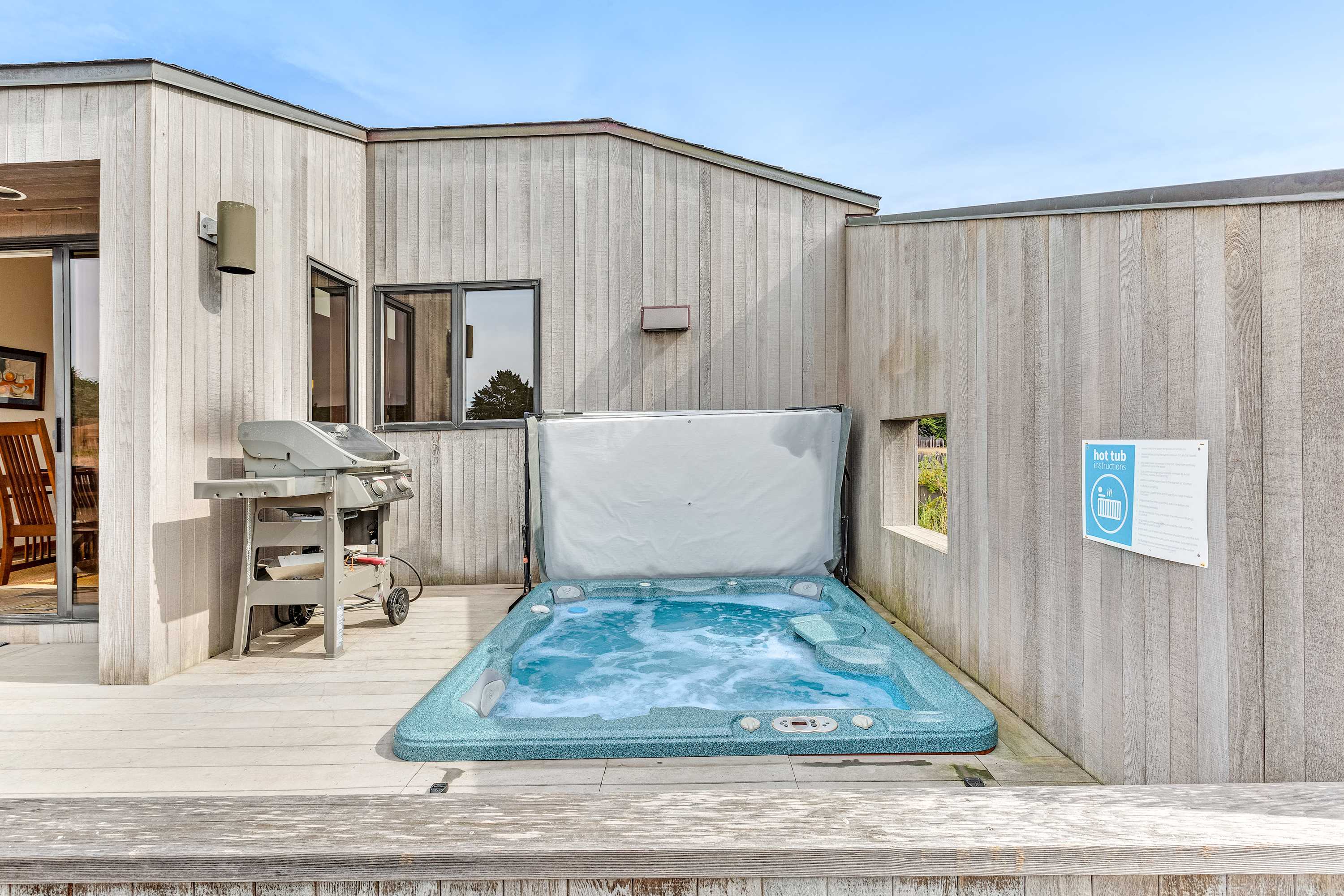 Unwind in the private hot tub on the deck, sheltered from the breeze and just steps from the BBQ grill for a perfect evening on the coast.