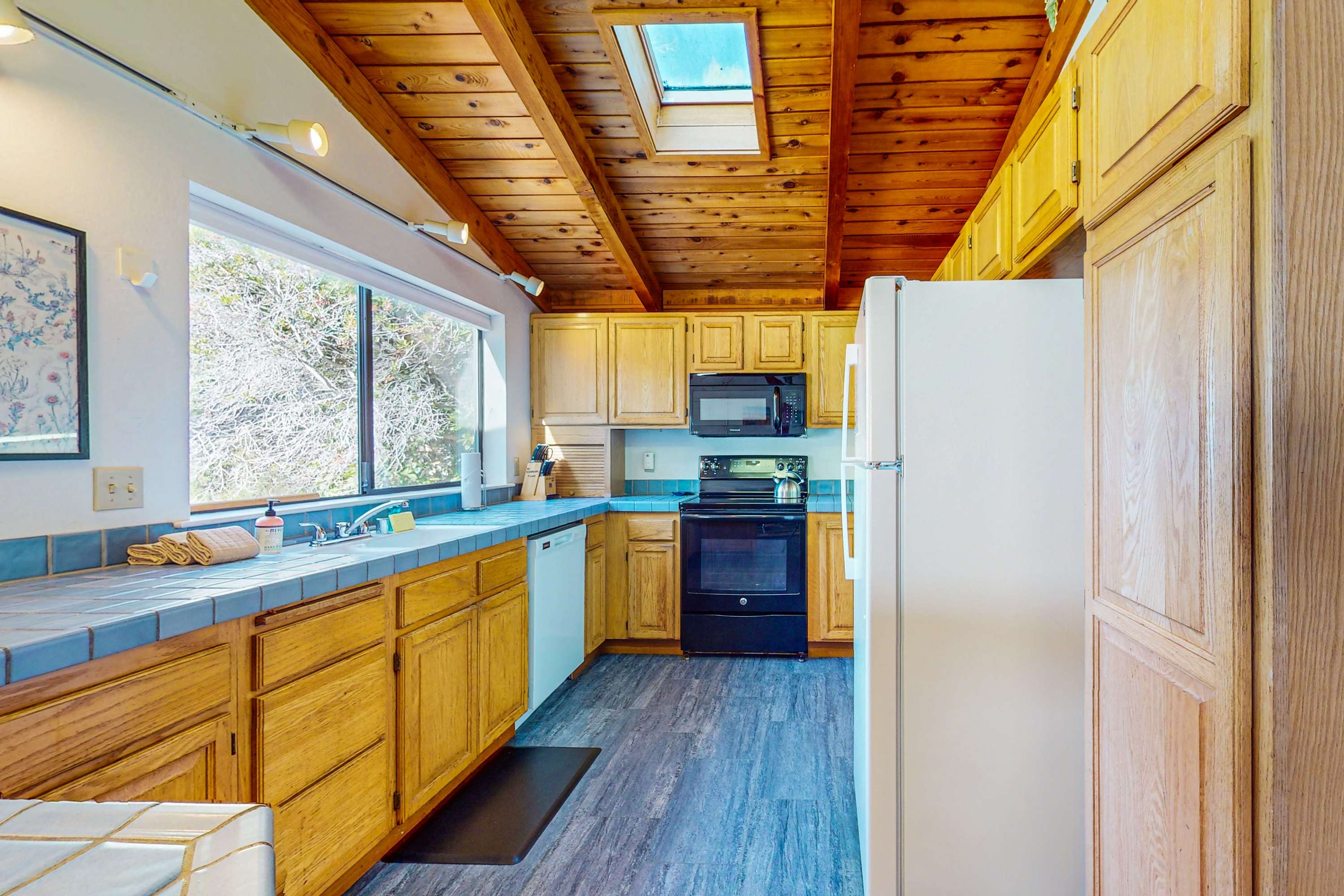 Cook up delicious meals in the well-equipped kitchen, where natural light and a spacious layout inspire culinary creativity.