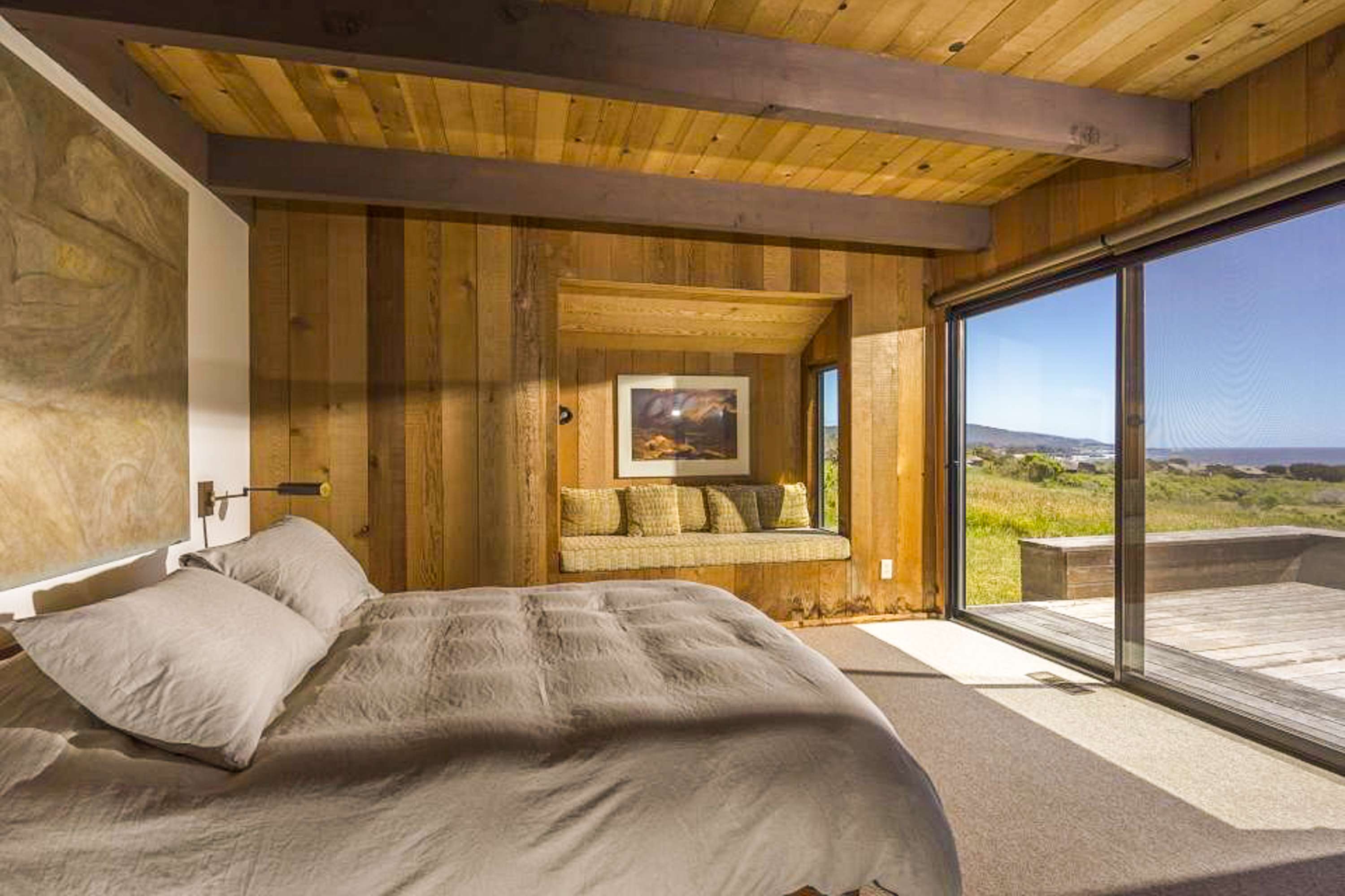 Awake to breathtaking views in this spacious master suite, where comfort and tranquility blend seamlessly with the beauty of the outdoors.