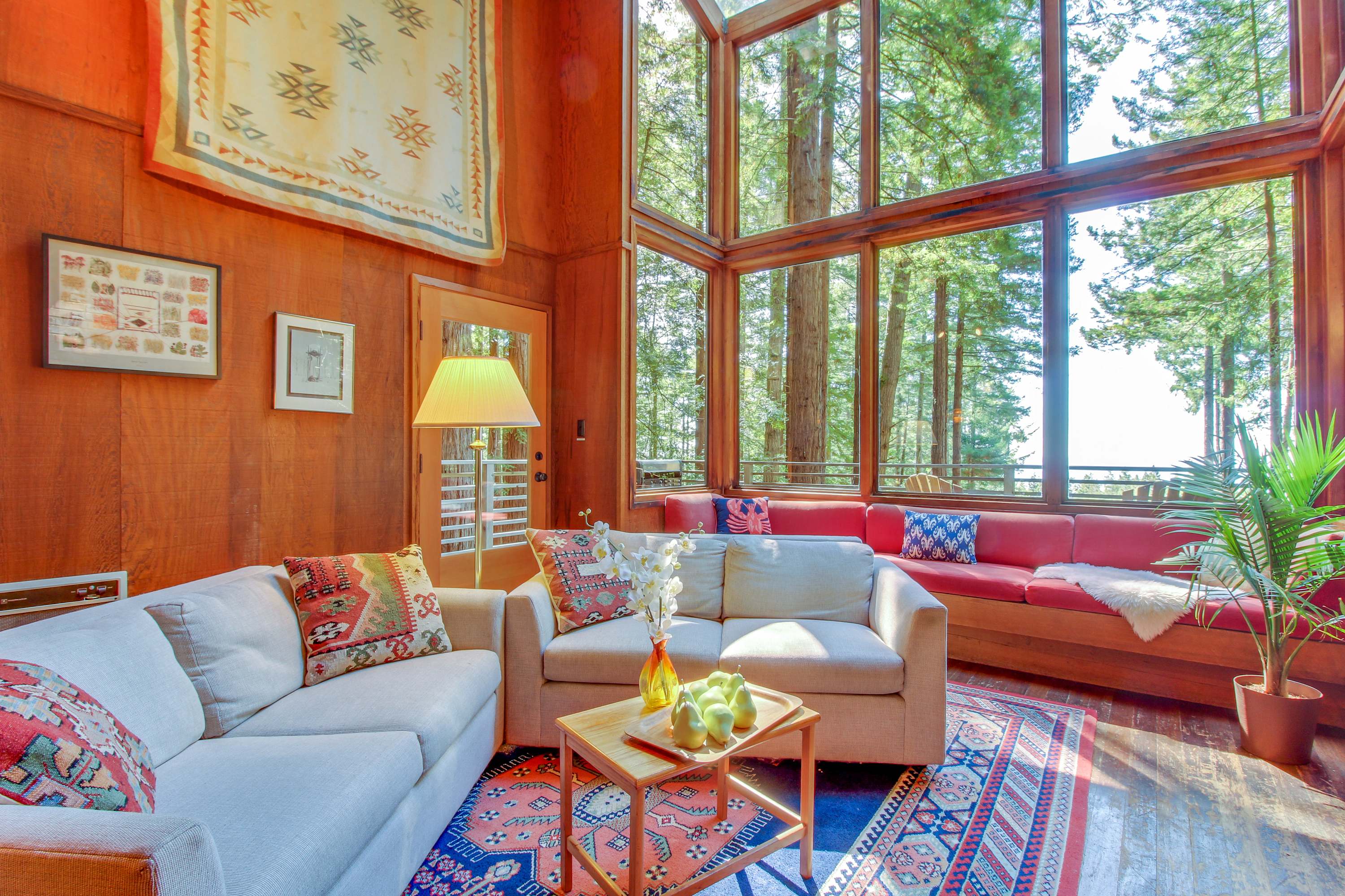 Gather with loved ones in this warm living space, designed for comfort and filled with natural light.