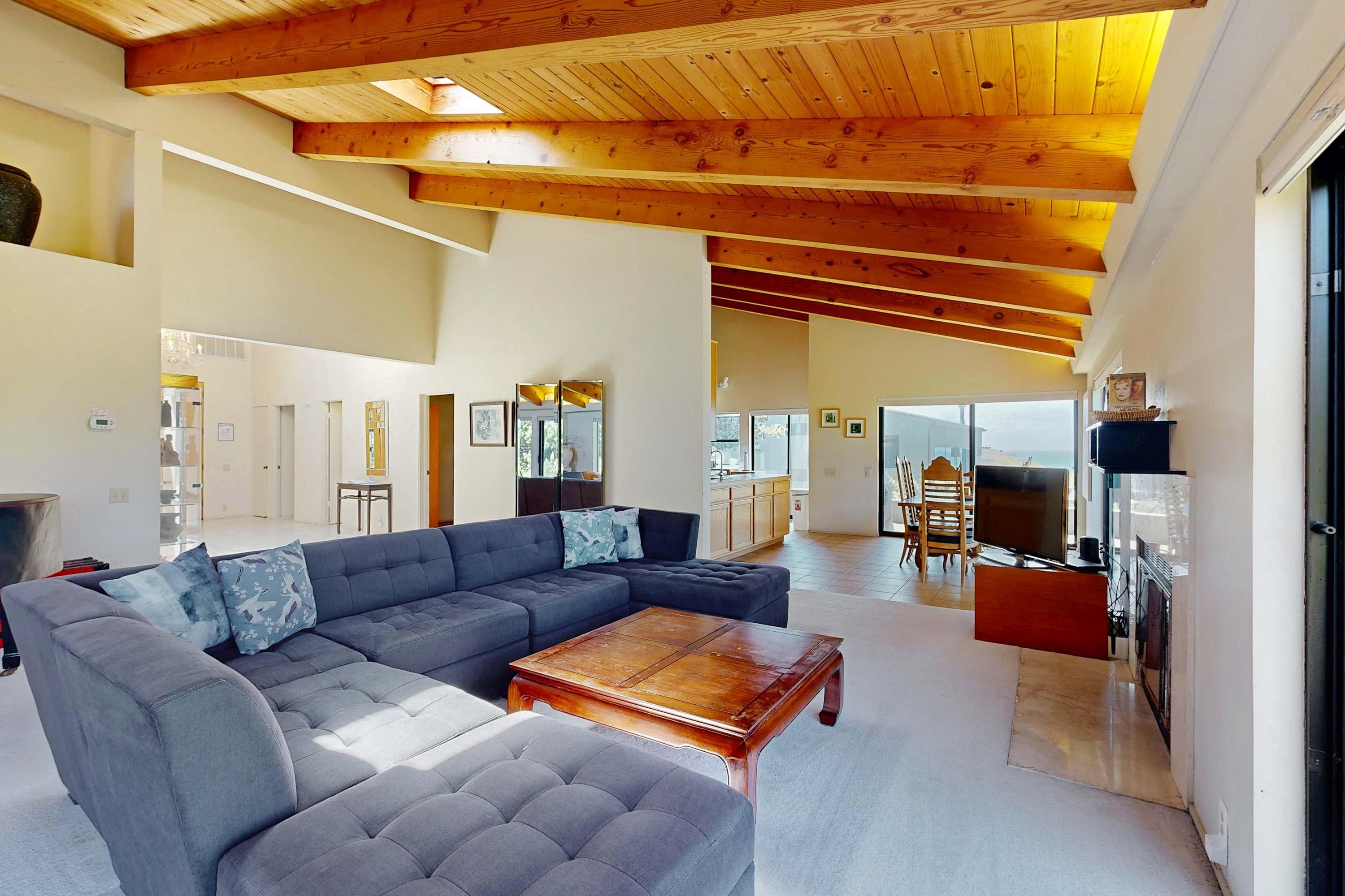 Morning light fills the spacious living room, inviting you to relax and enjoy ocean views from every angle.