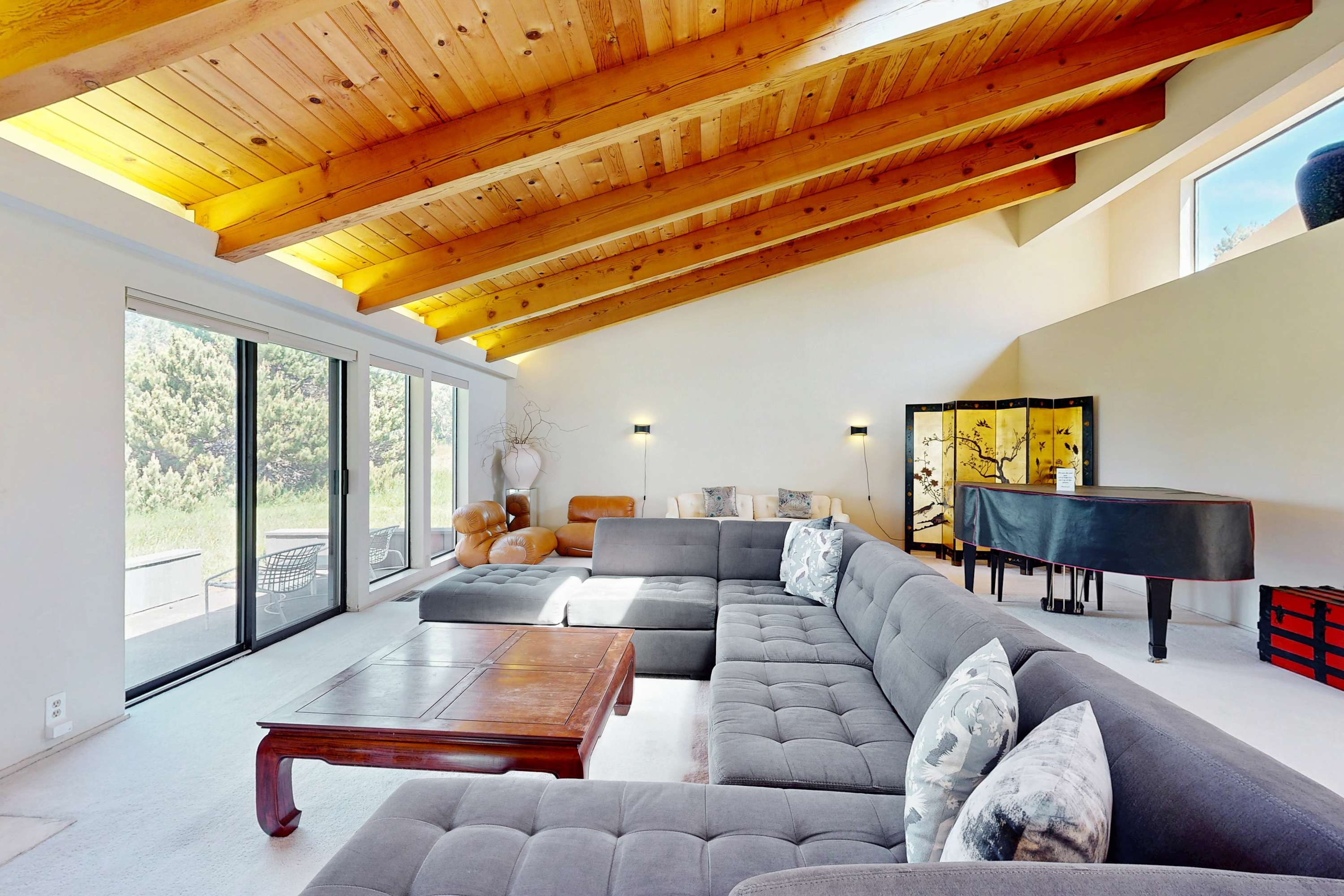 Gather your loved ones in this cozy living room, perfect for game nights or watching the sunset together.