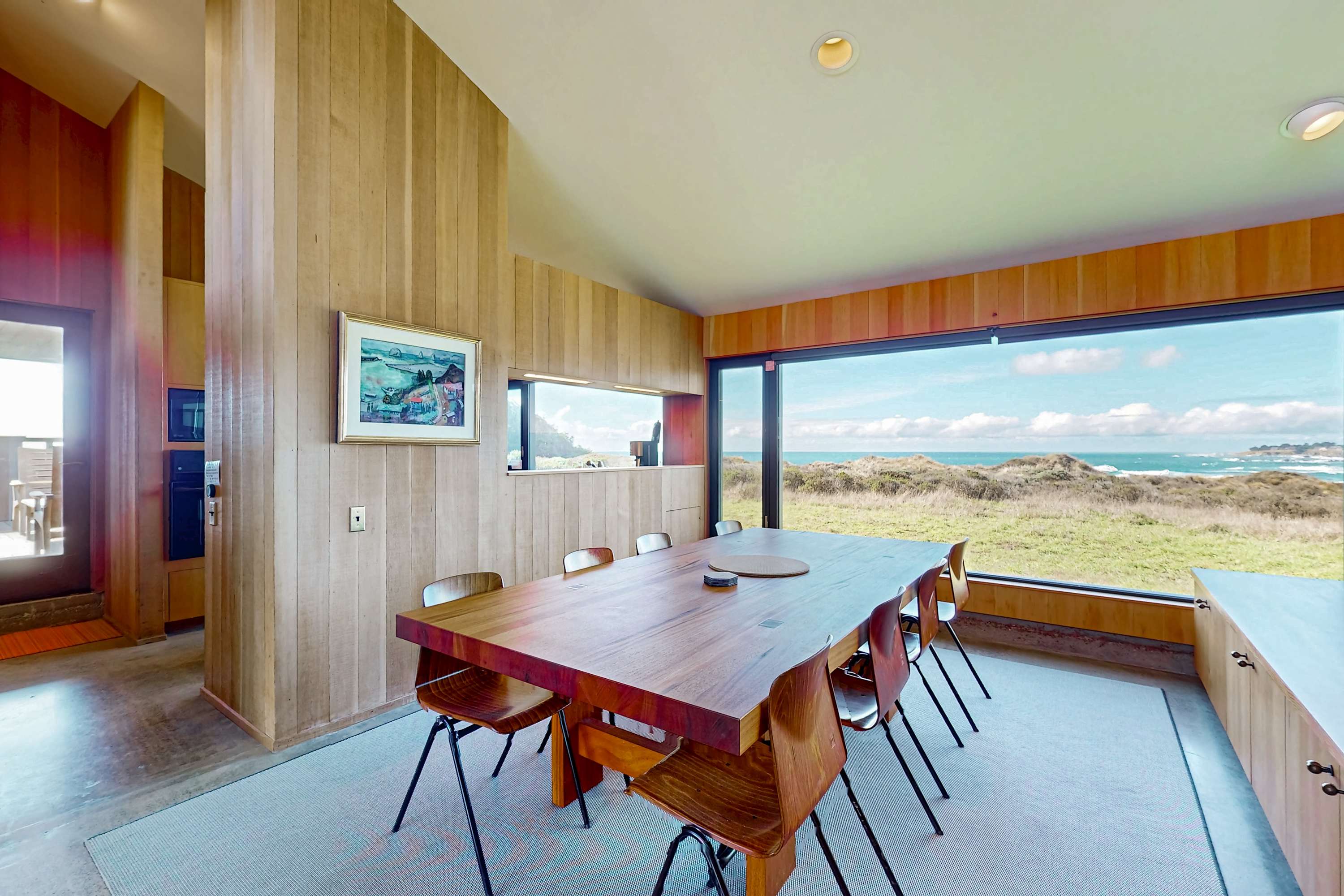 Gather around the dining table as natural light pours in, creating a warm and inviting atmosphere for shared meals and laughter.