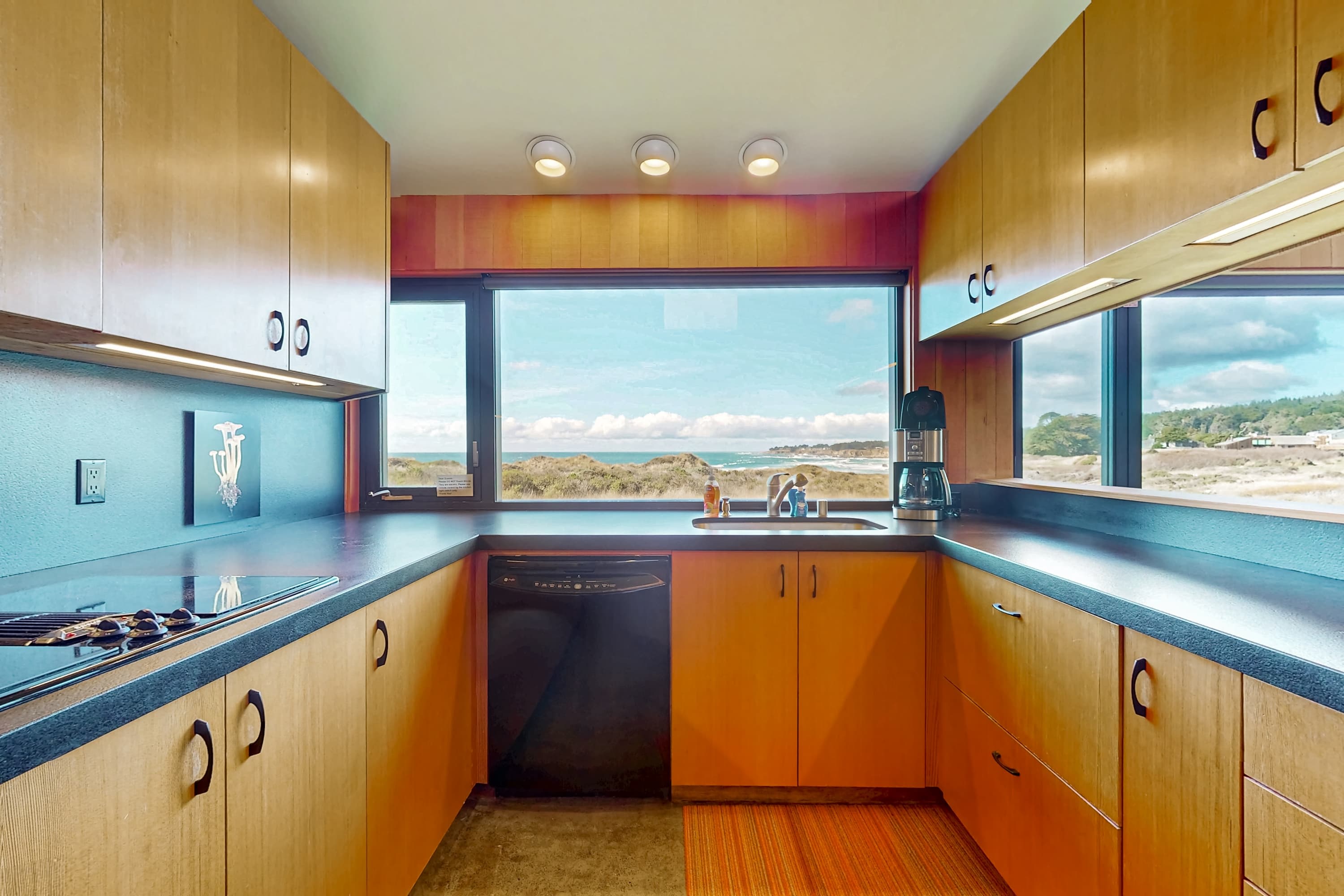 Craft culinary delights in this well-equipped kitchen, where the ocean view inspires your culinary creativity and makes meal prep a joy.