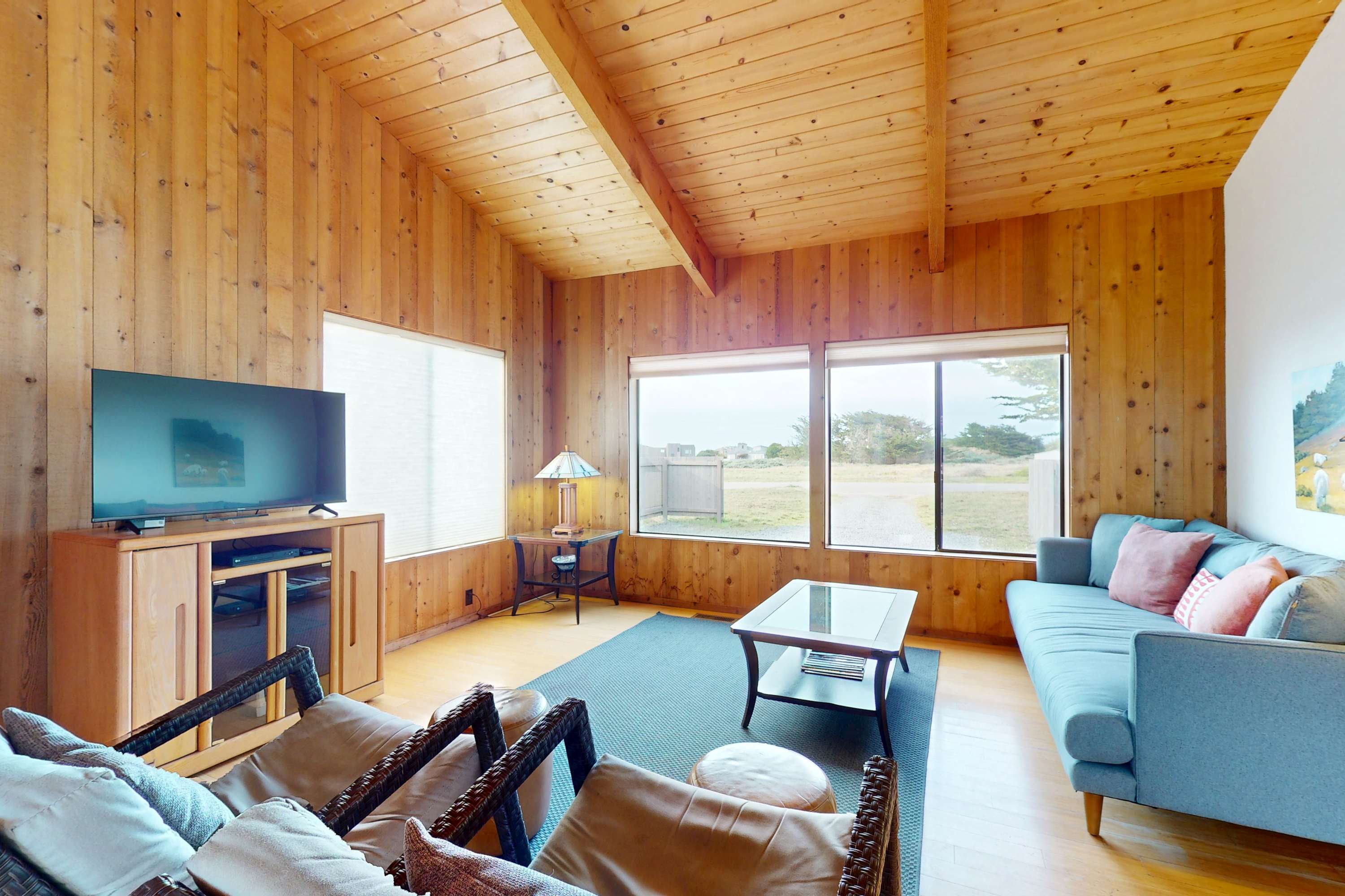 Morning light spills into the cozy living room, inviting you to relax and enjoy the tranquil ambiance of Sea Ranch.