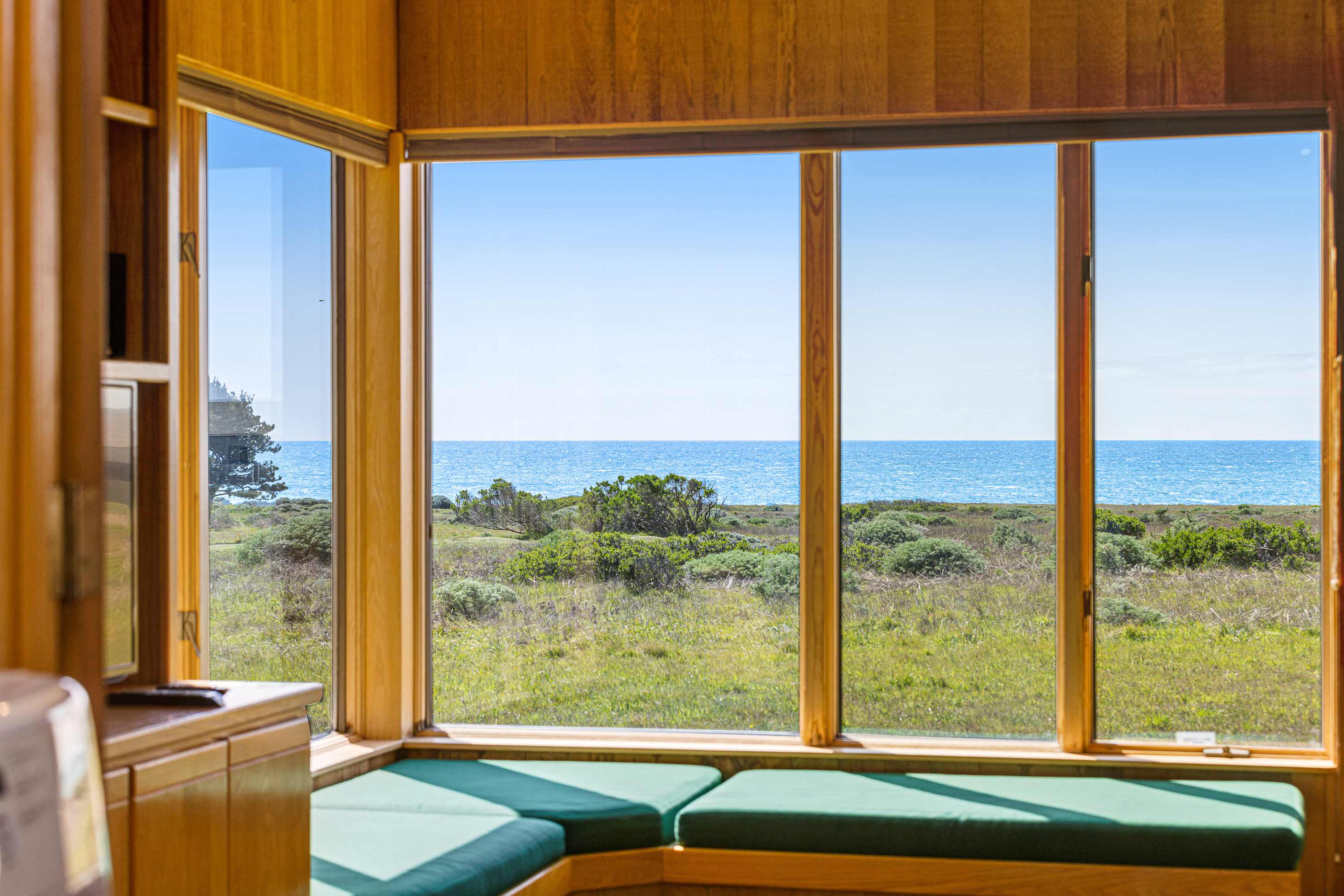 Imagine sipping your morning coffee while soaking in the stunning ocean view from this sunlit window seat.