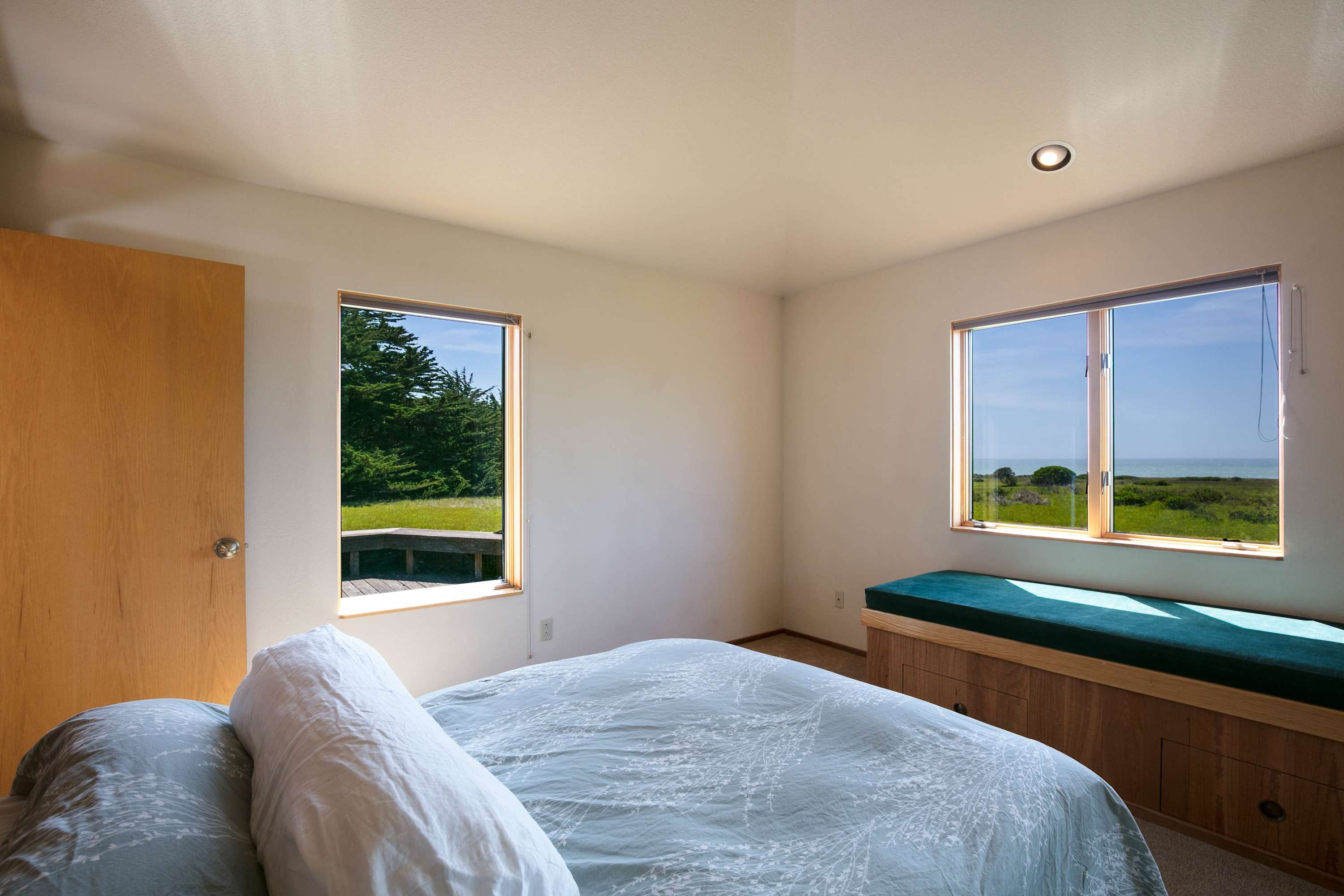 Enjoy bright, airy mornings in this master bedroom, designed for relaxation with spectacular views just outside your window.