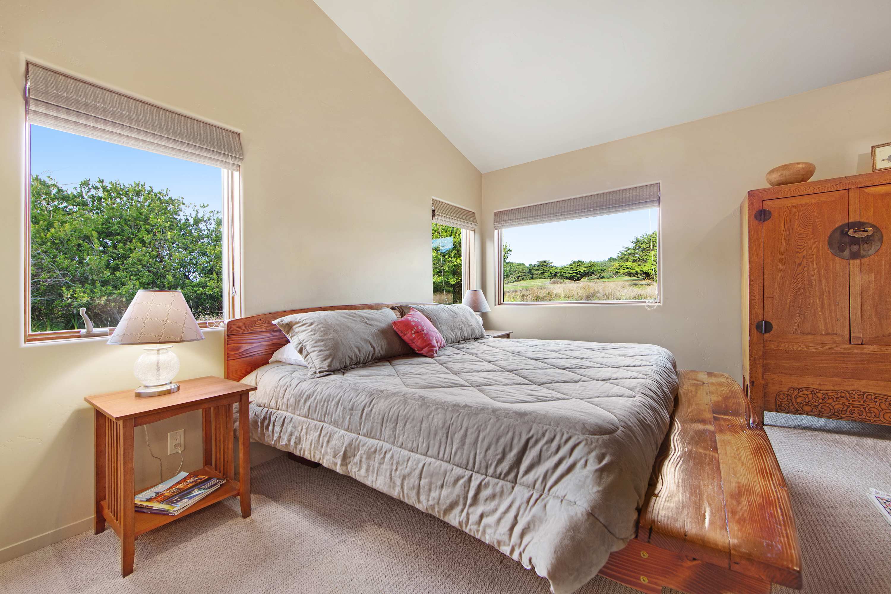 Wake up in the tranquil primary bedroom, where serene views invite you to start your day in peace and comfort.