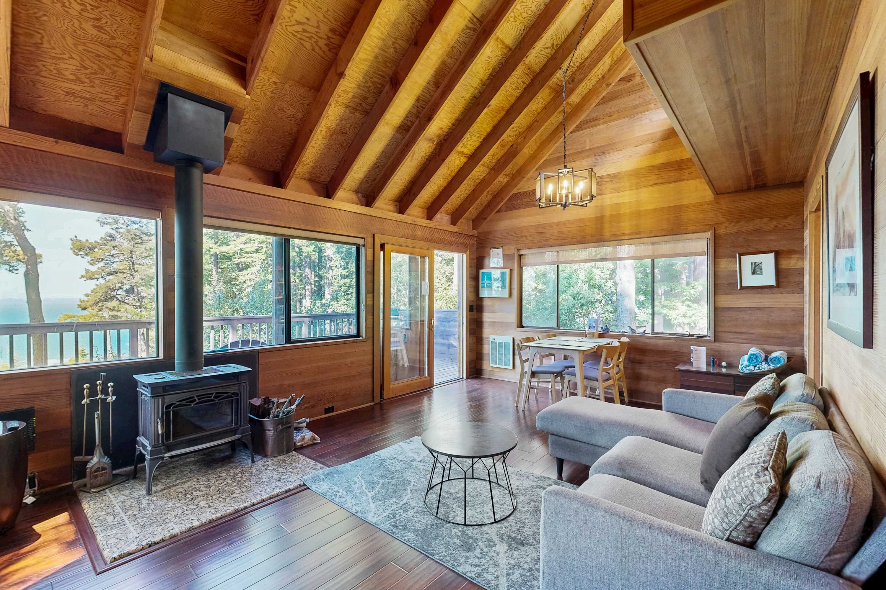 Gather with loved ones in this inviting living space, perfect for cozy nights by the fire or watching the waves crash outside.