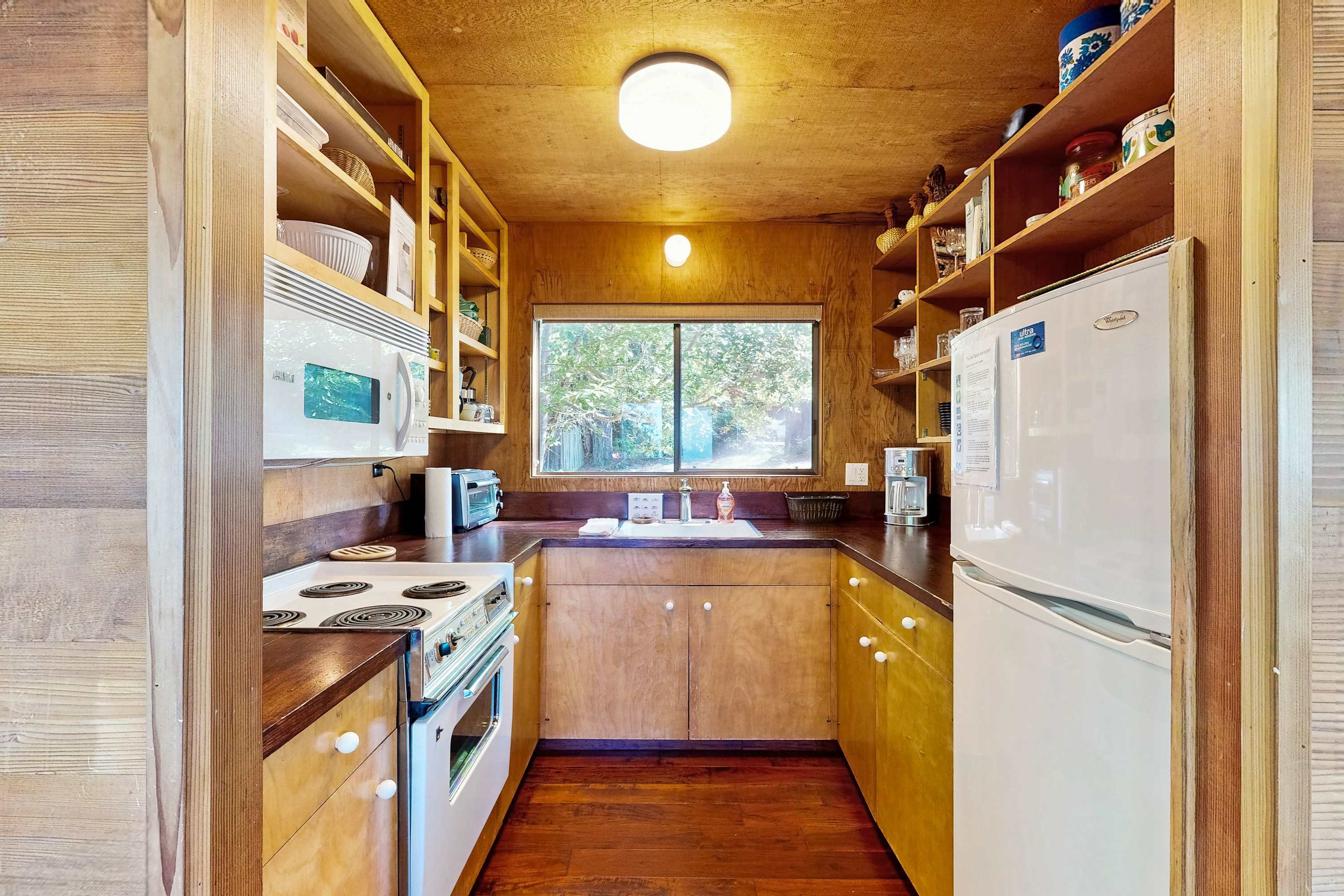 Cook up your favorite meals in this well-equipped kitchen, with views that inspire culinary creativity.