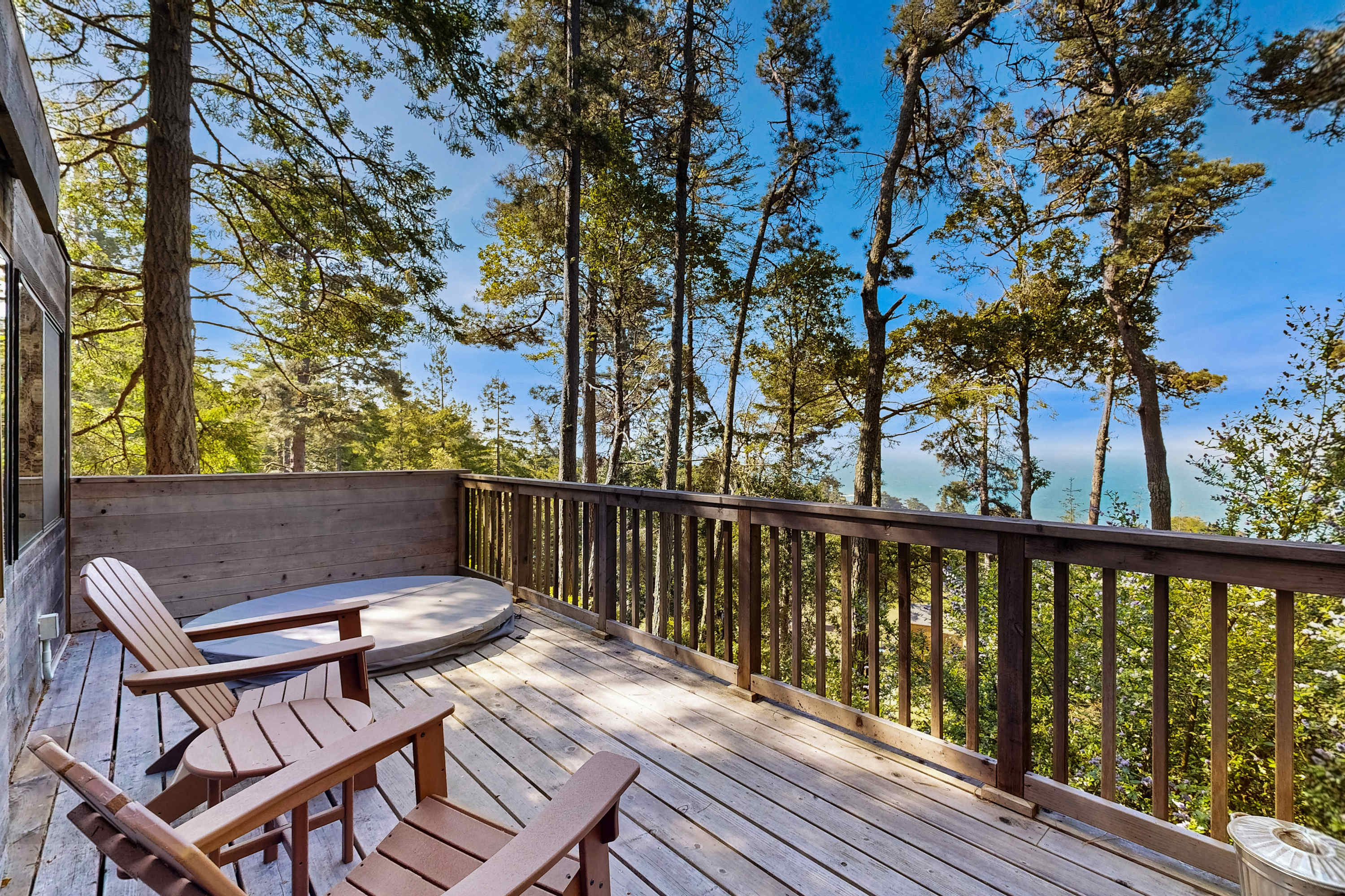 Friends can gather on the outdoor deck, where you can soak in the hot tub or simply take in the breathtaking coastal views.