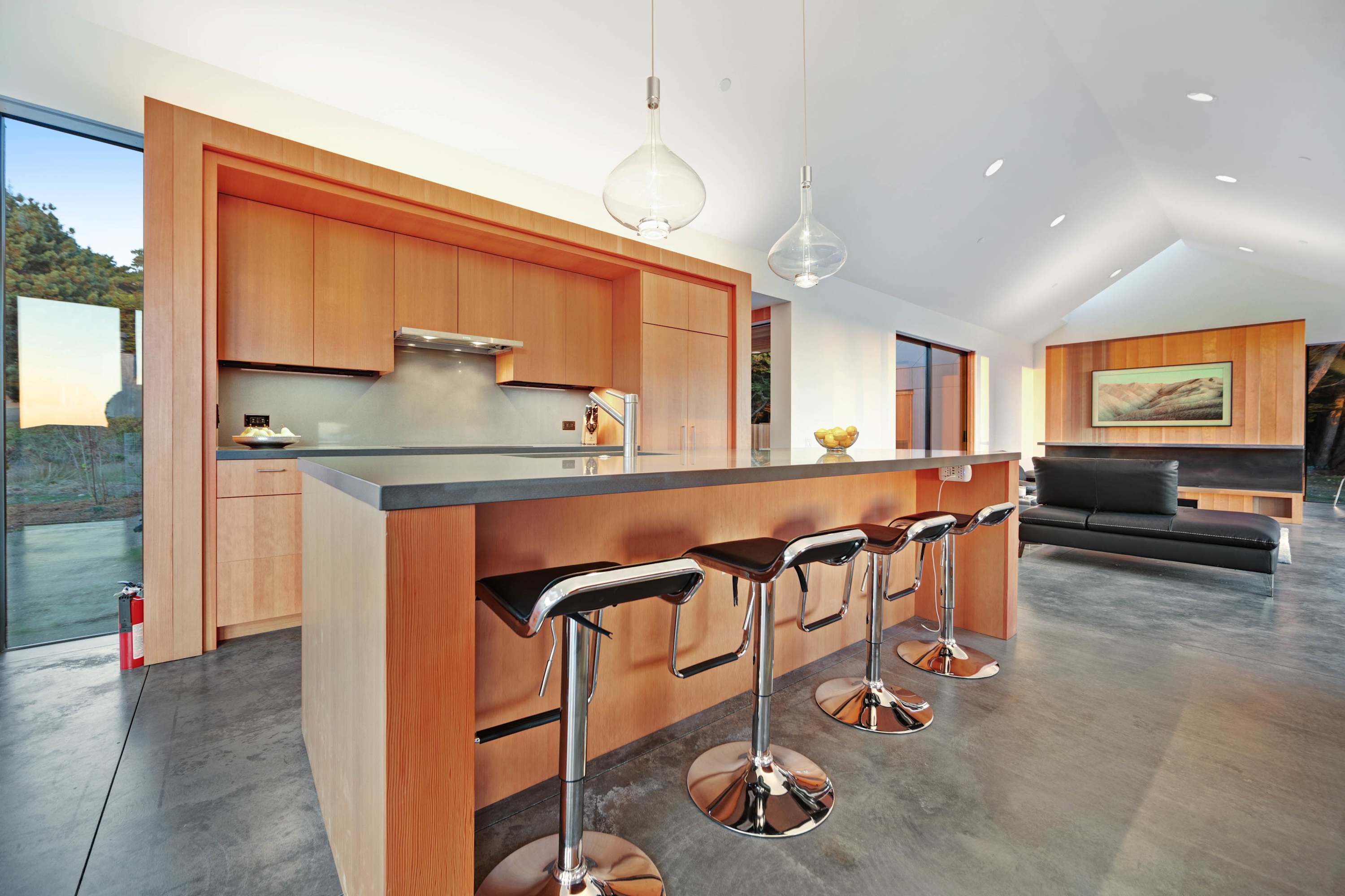 Your culinary adventures await in this modern kitchen, designed for both efficiency and style, with ample space for meal prep.