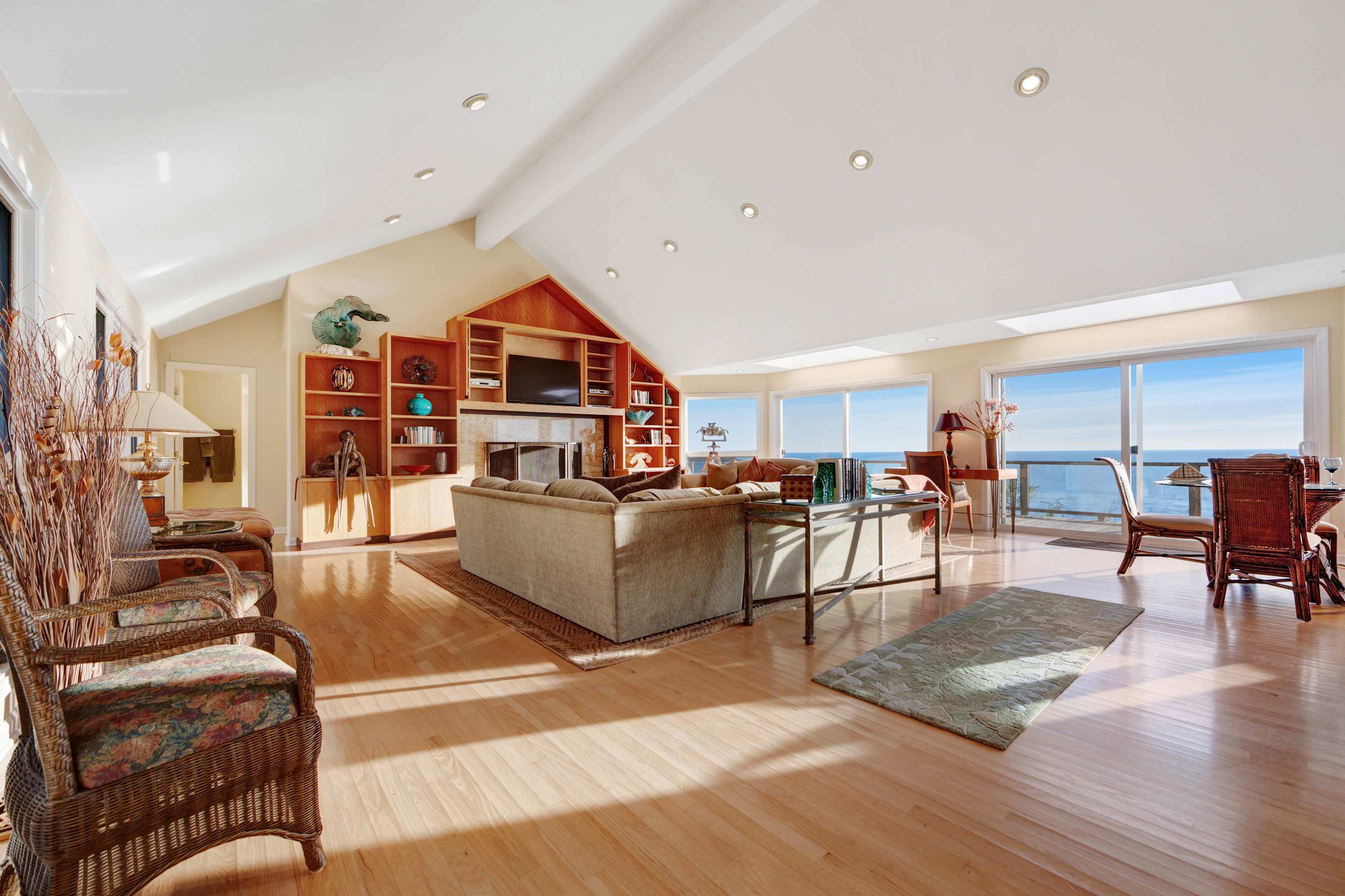 Morning light fills the living room, inviting you to relax with a book or enjoy a cozy evening by the wood-burning fireplace.